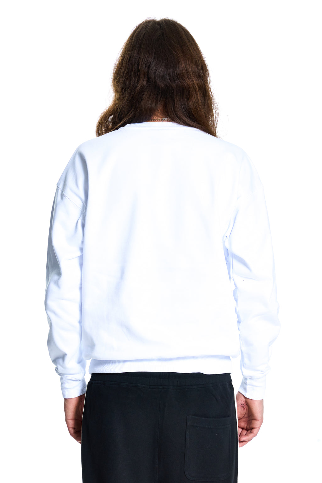 Person wearing a BOY London white sweatshirt and black pants on a white background