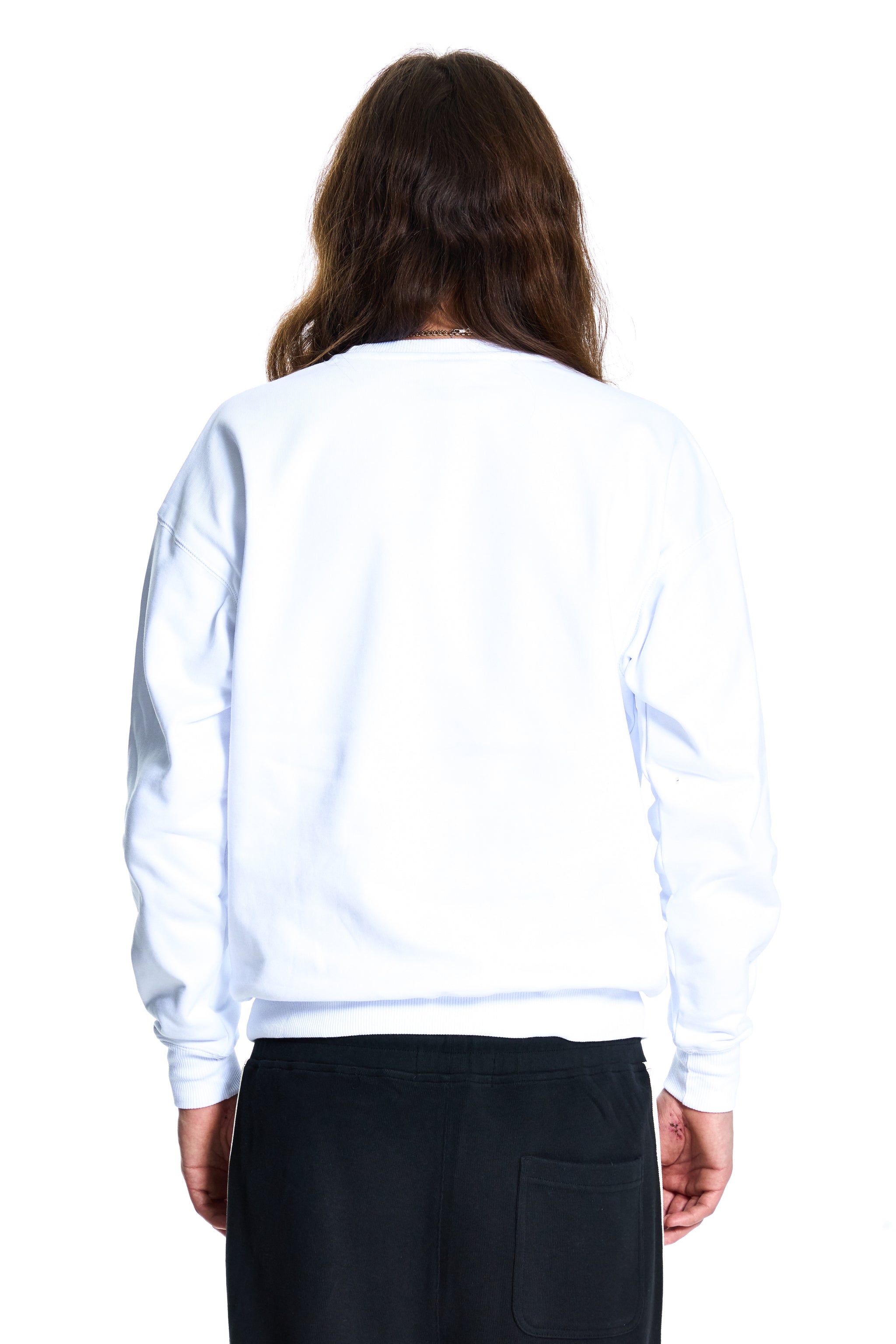 Person wearing a BOY London white sweatshirt and black pants on a white background