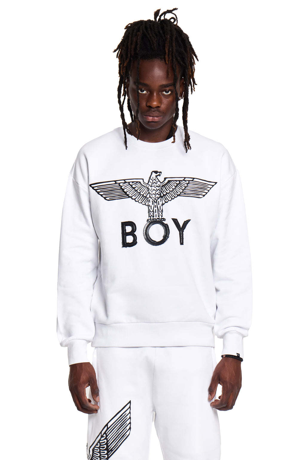 Person wearing a white sweatshirt with 'BOY' London logo on a white background