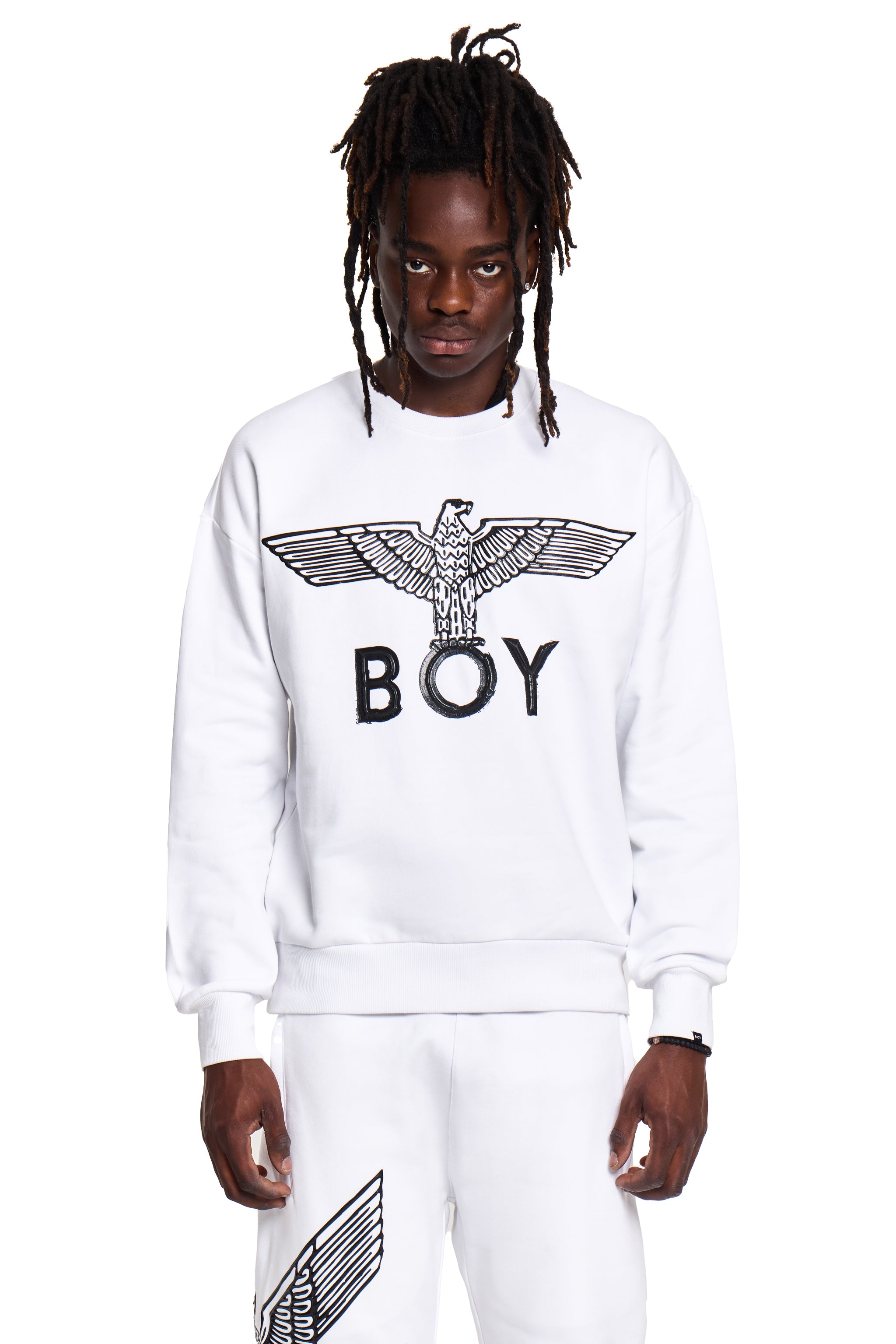 Person wearing a white sweatshirt with 'BOY' London logo on a white background