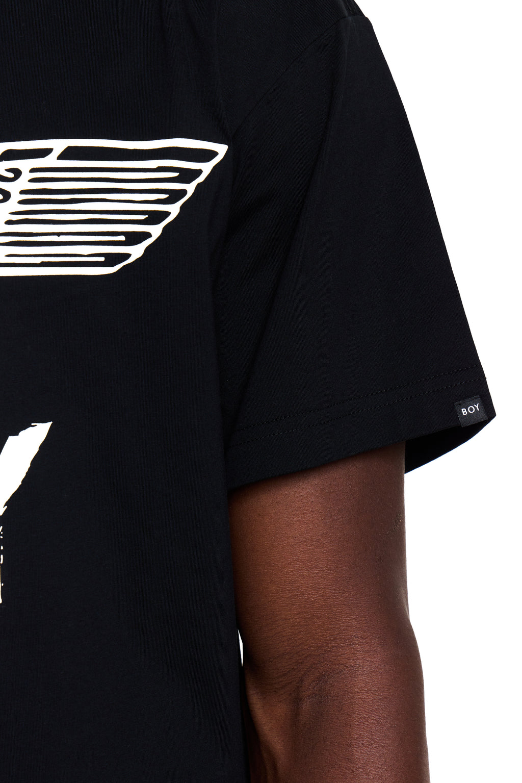 Black t-shirt with white BOY London graphic design on a person wearing it