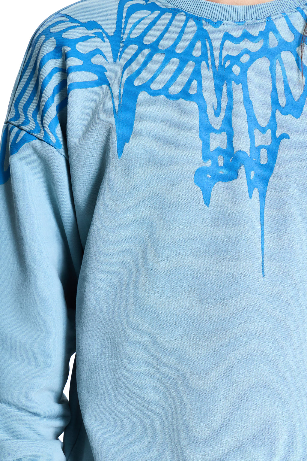Light blue sweatshirt with blue abstract designs on sleeves