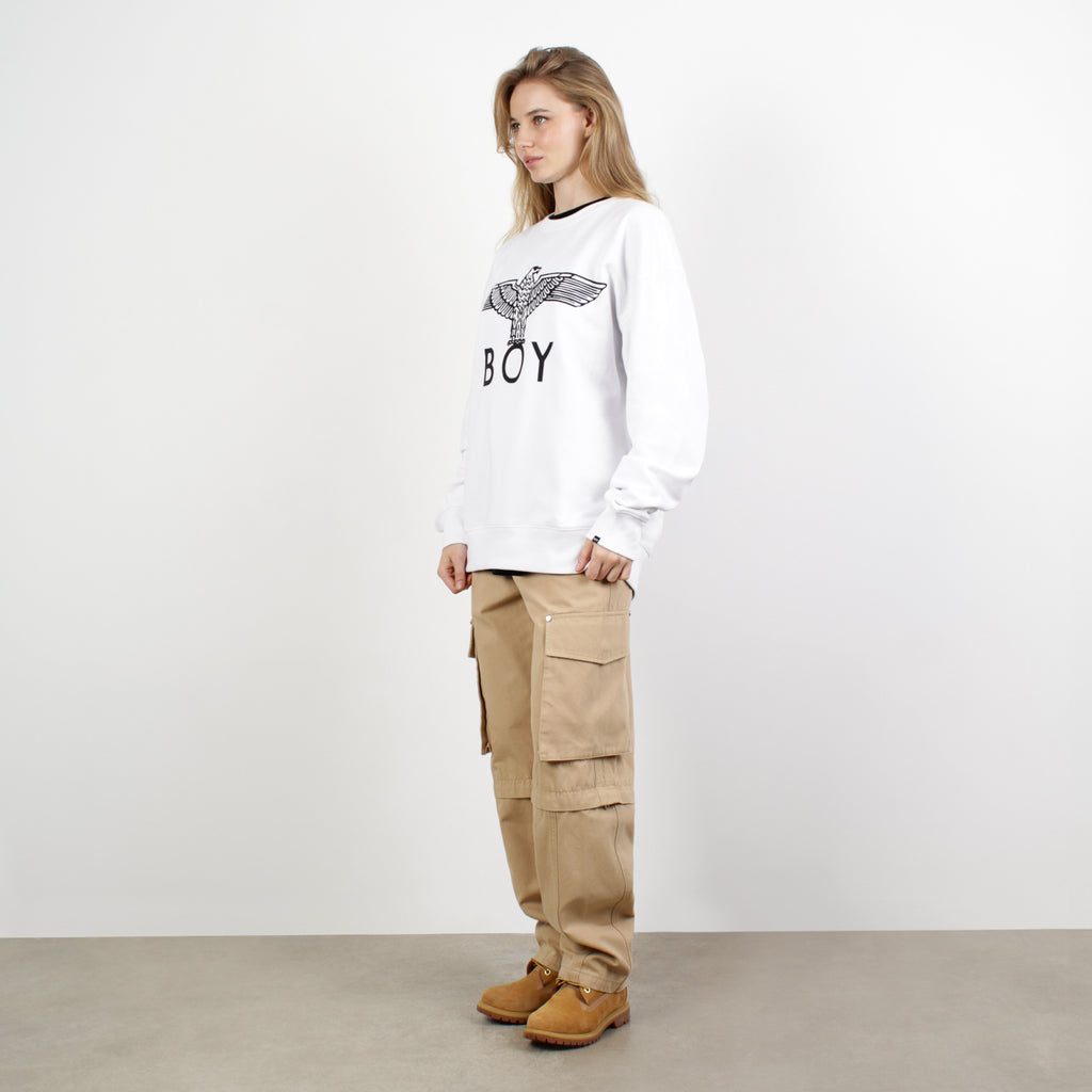 female model wearing BOY LONDON on white background 