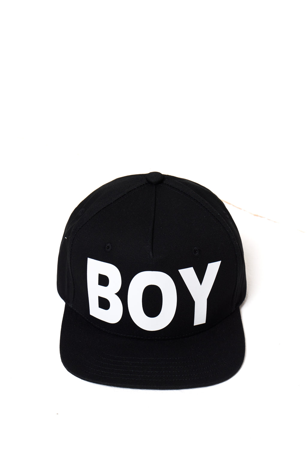 Black cap with 'BOY' London printed in white on a white background