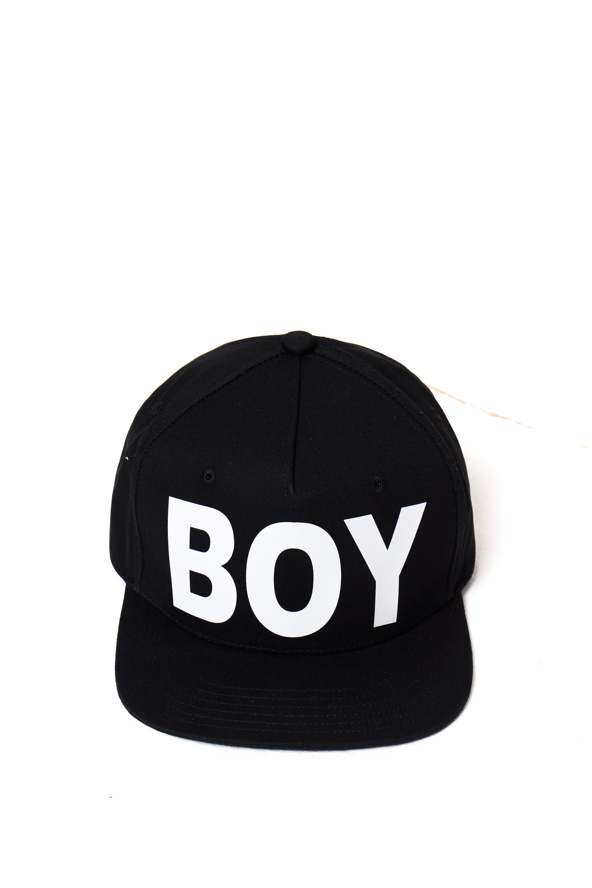 Black cap with 'BOY' London printed in white on a white background