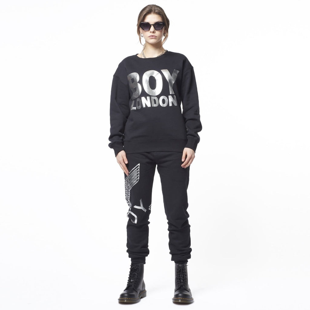 Model wearing Black sweatshirt with 'BOY LONDON' text on a white background
