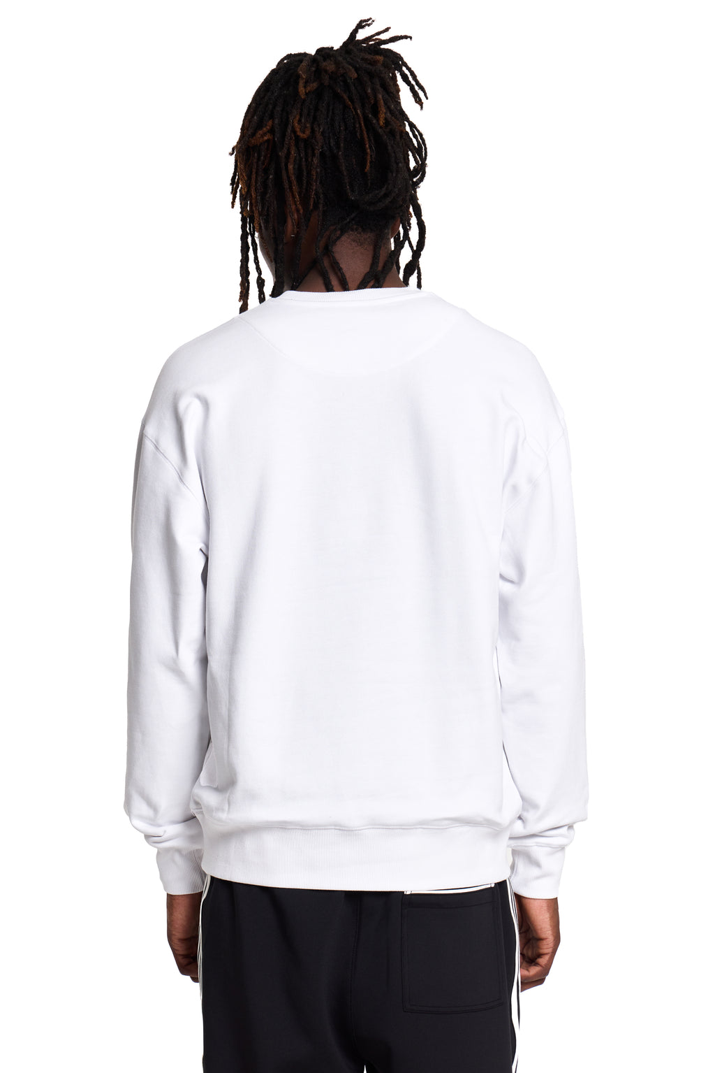 Model wearing a white BOY London sweatshirt on a white background