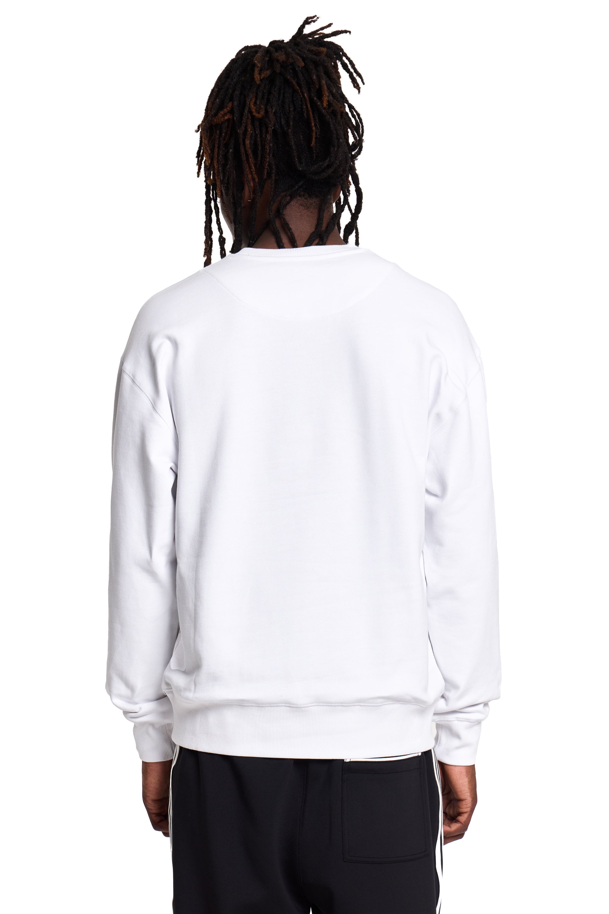 Model wearing a white BOY London sweatshirt on a white background