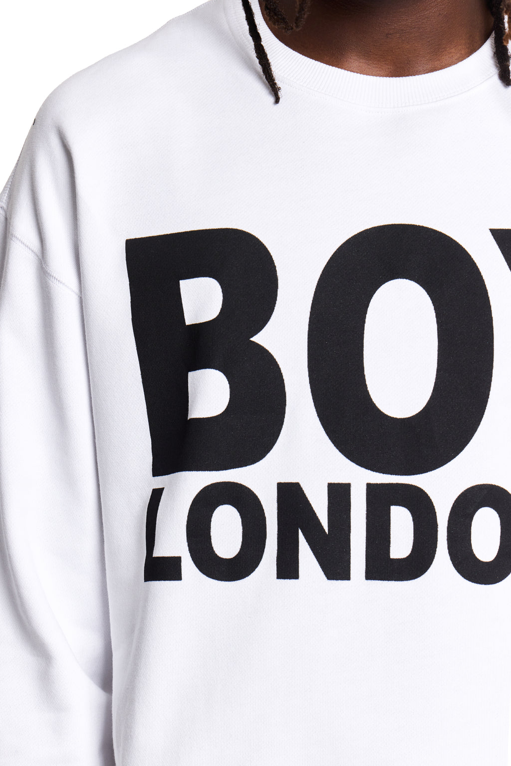Model wearing White hoodie with 'BOY LONDON' text on a plain background