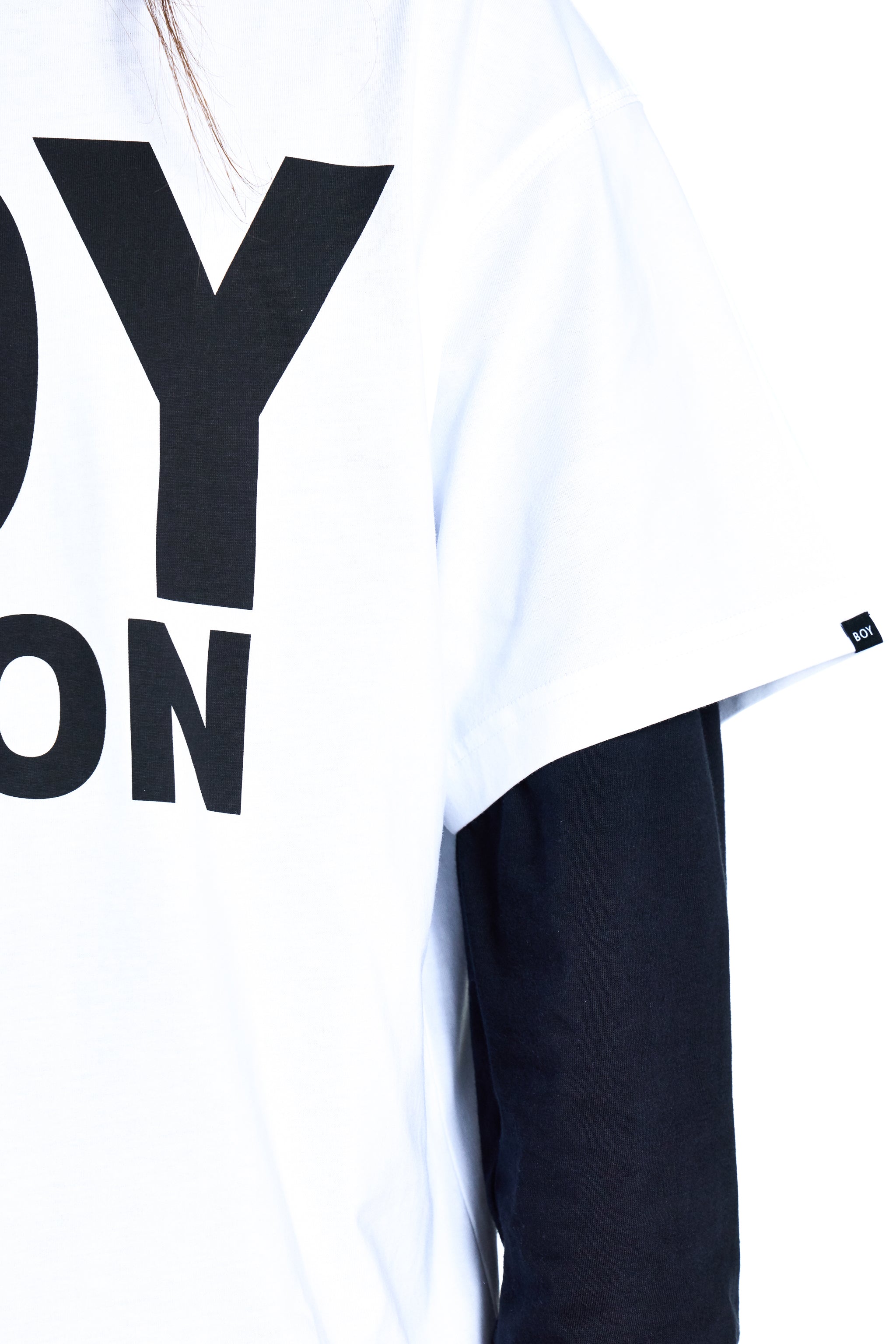 White t-shirt with black text on a white background
