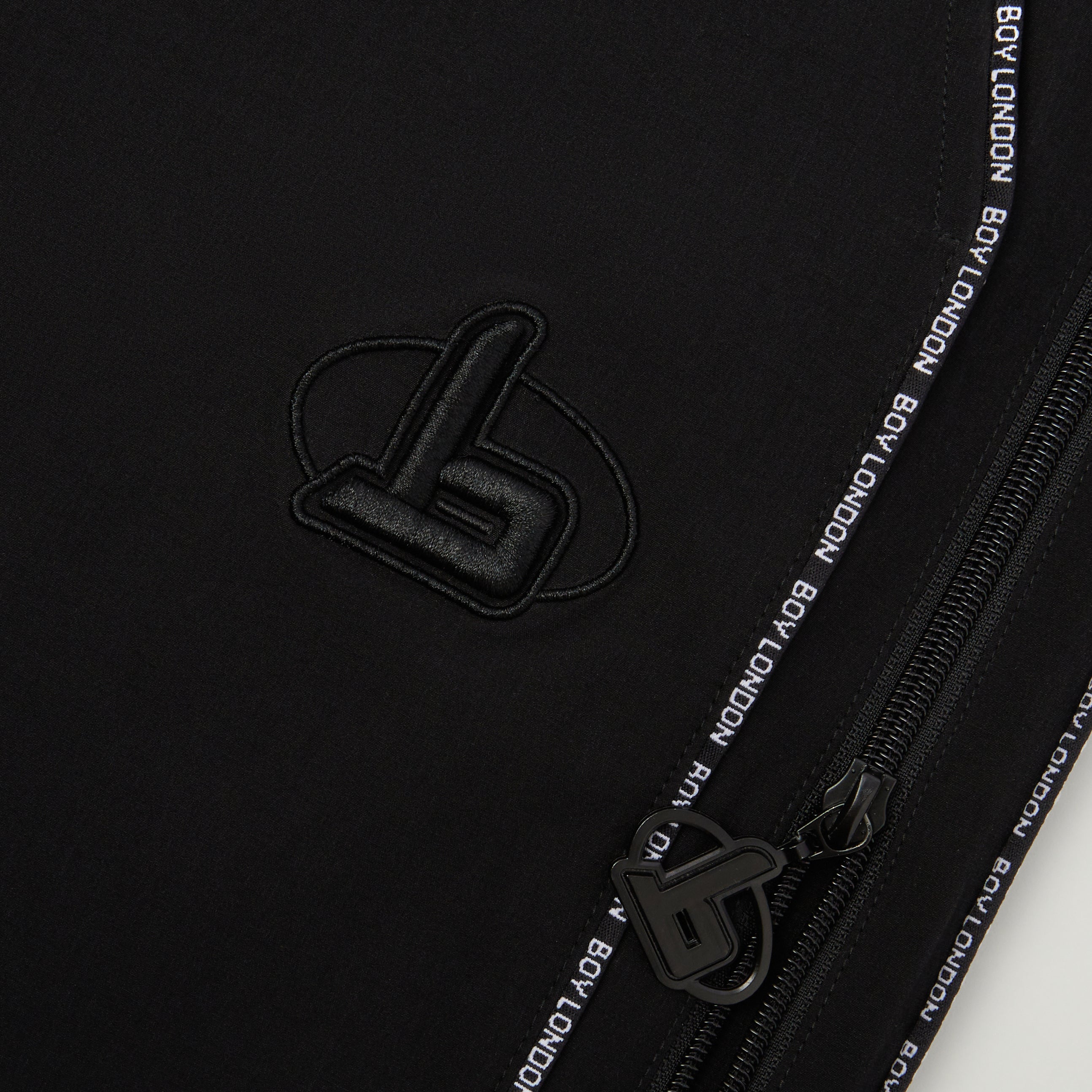Close up of BOY London track pants