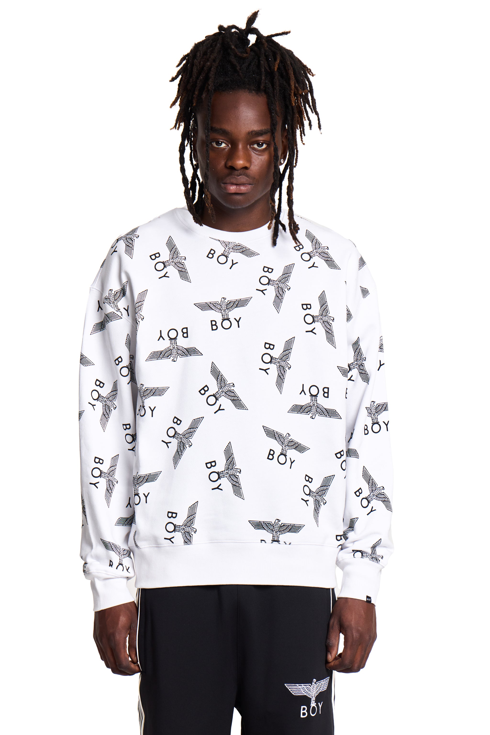Person wearing a white Boy London sweatshirt with black and gray patterns on a white background