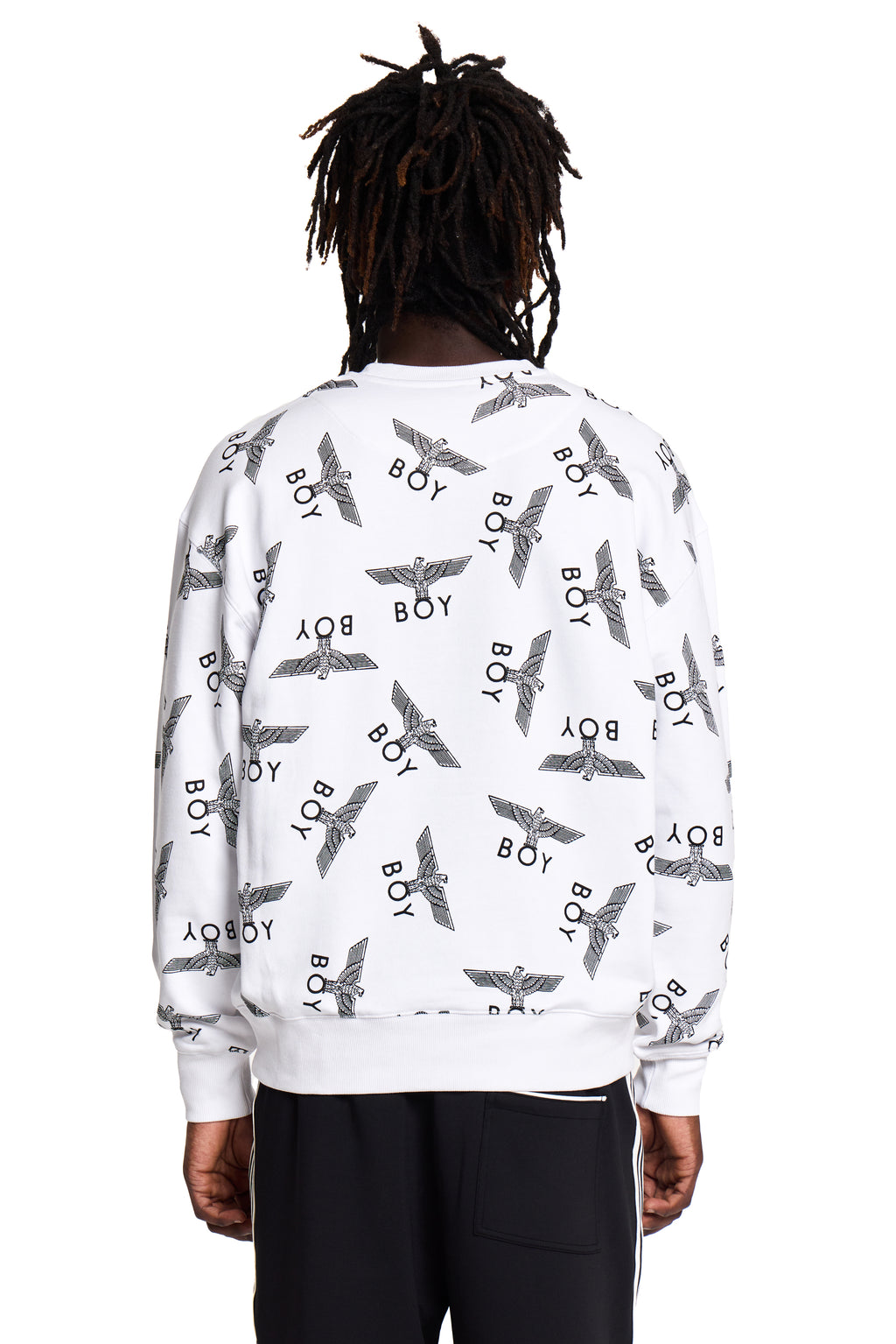 Person wearing a white Boy London sweatshirt with black patterns and text on a white background