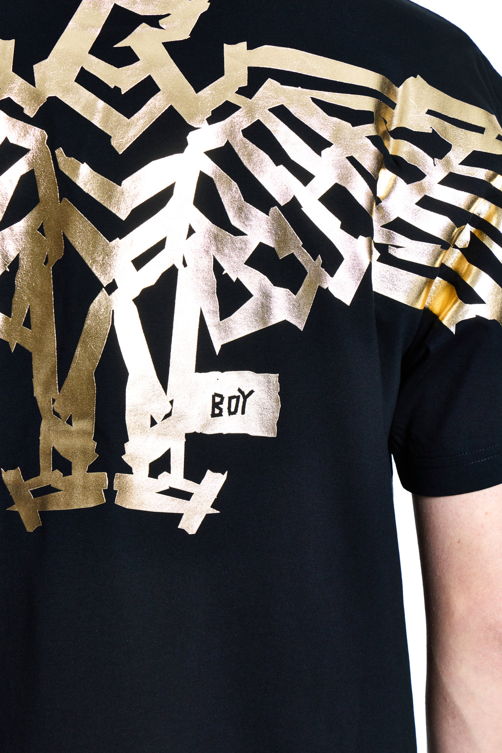 Black t-shirt with gold and white geometric patterns and 'BOY' logo.