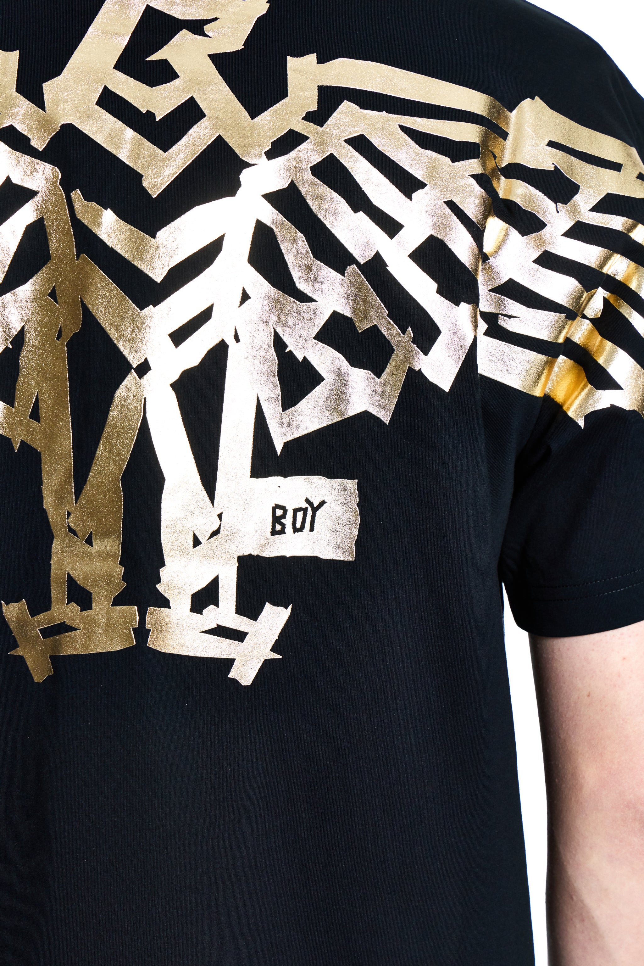 Black t-shirt with gold and white geometric patterns and 'BOY' logo.