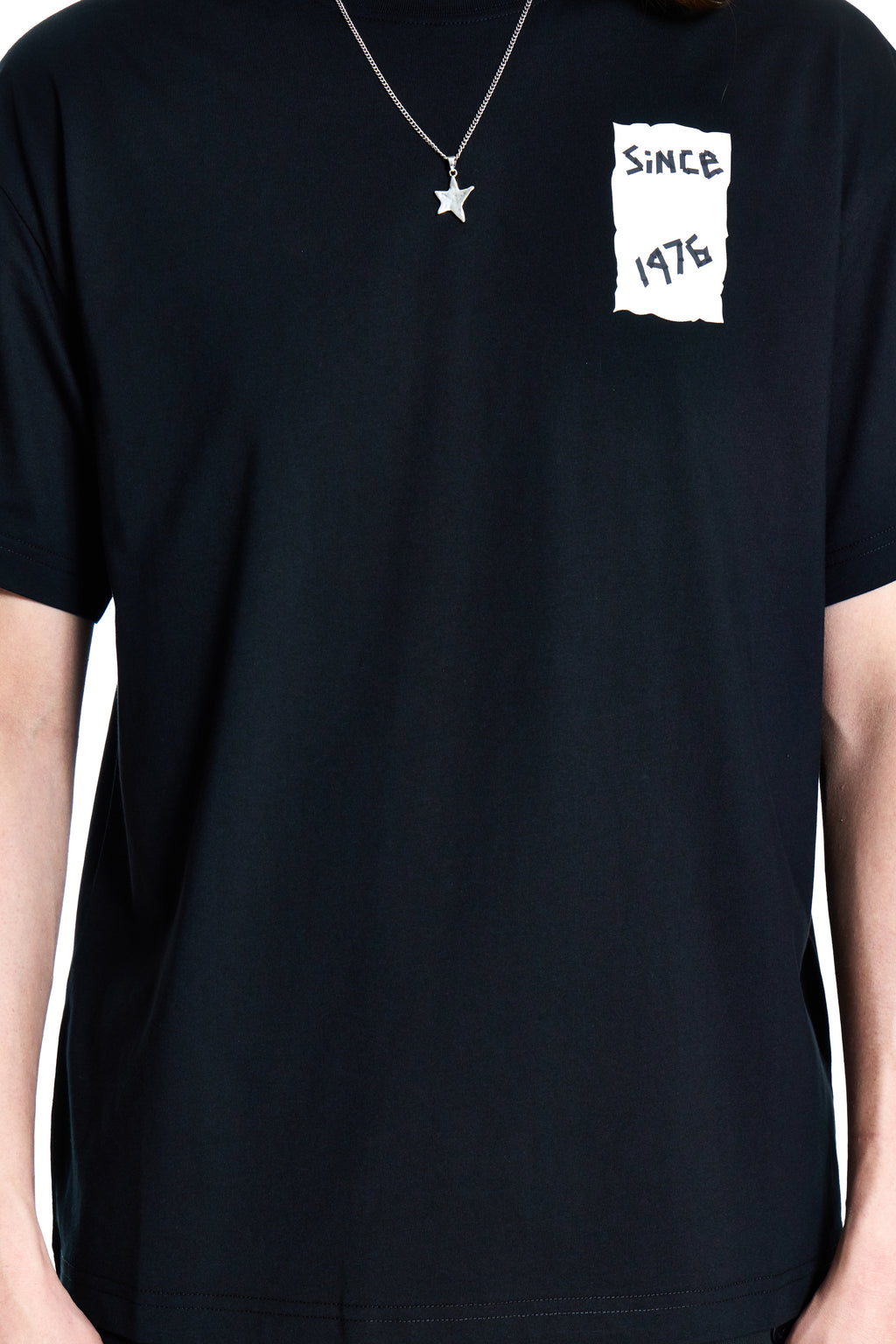 Black t-shirt with a white graphic design on a plain background