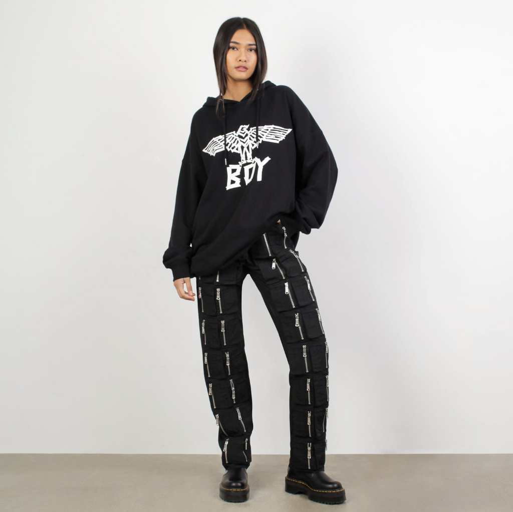 female model wearing BOY LONDON on white background 