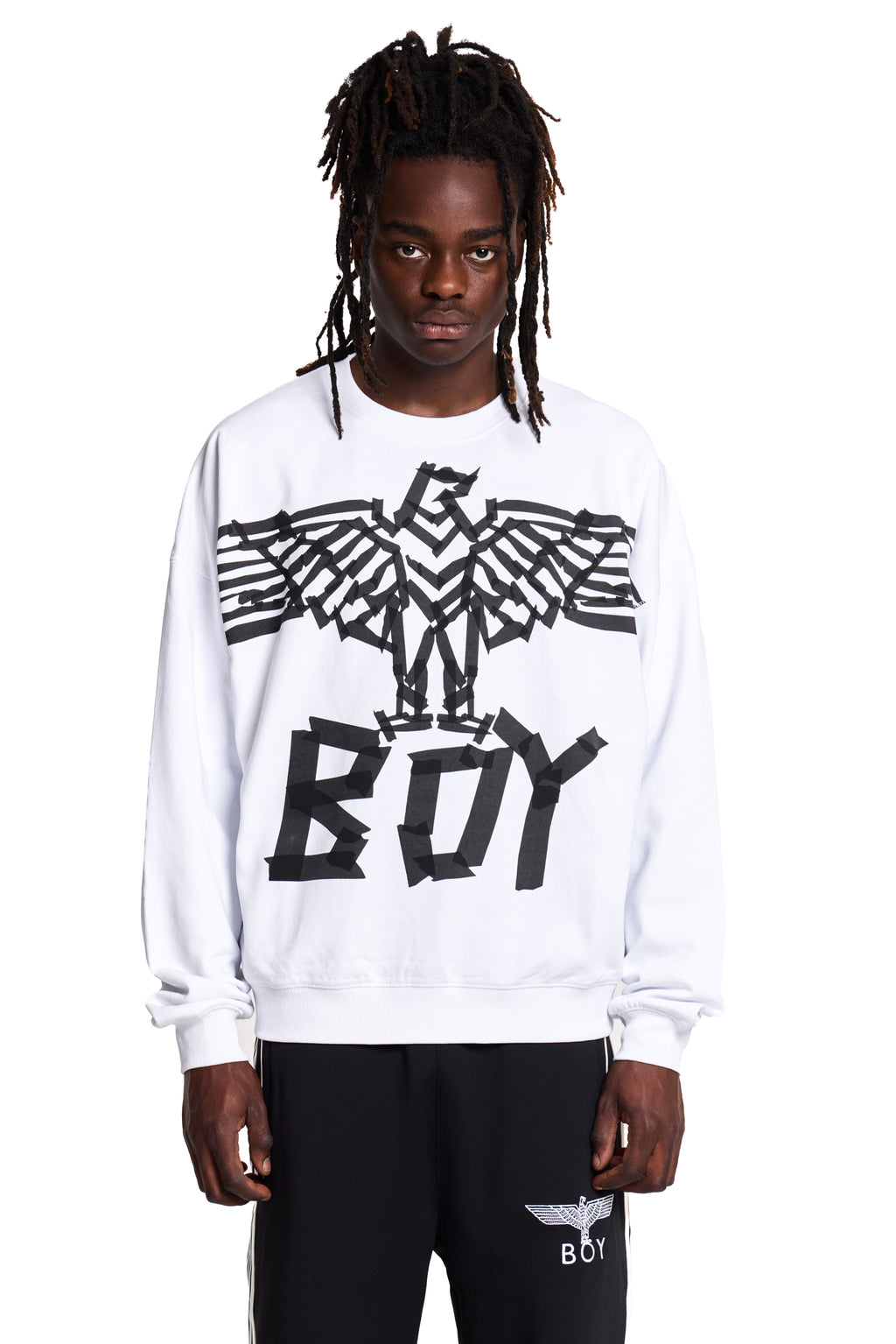 Model wearing a white BOY London sweatshirt with a black eagle logo and 'BOY' text on a white background