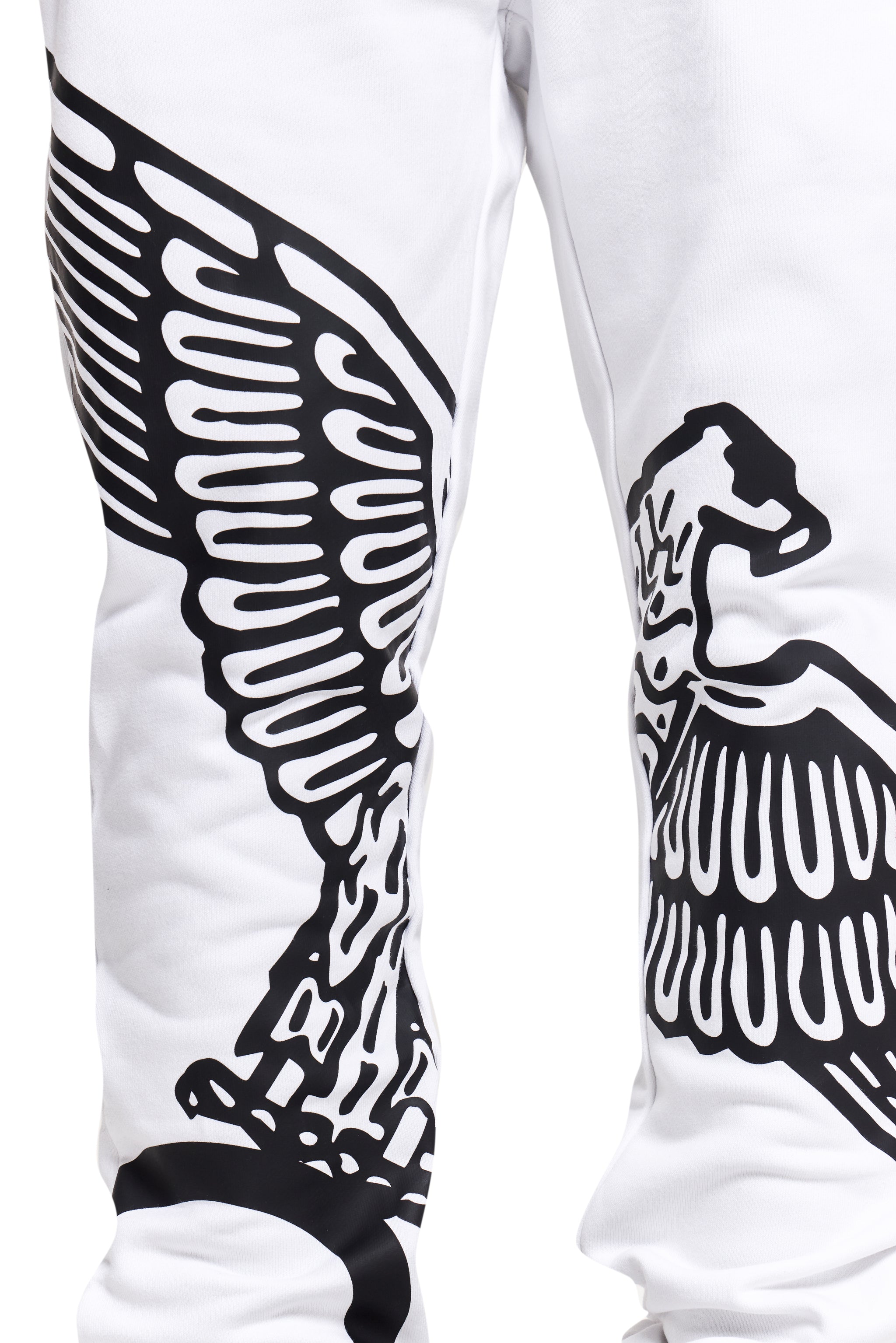 White BOY London pants with black wing-like designs on a white background