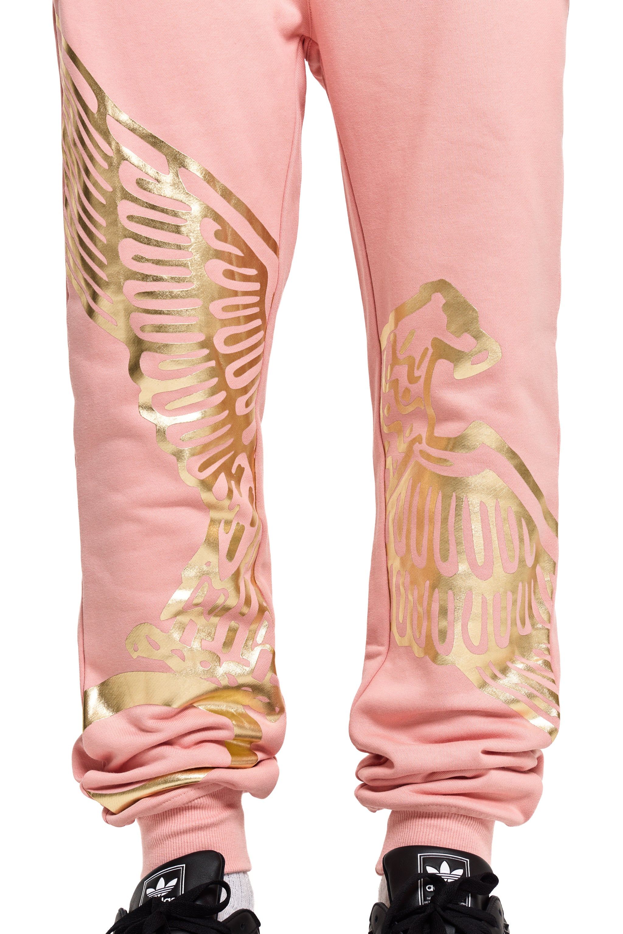 Pink BOY London sweatpants with gold eagle designs on a white background