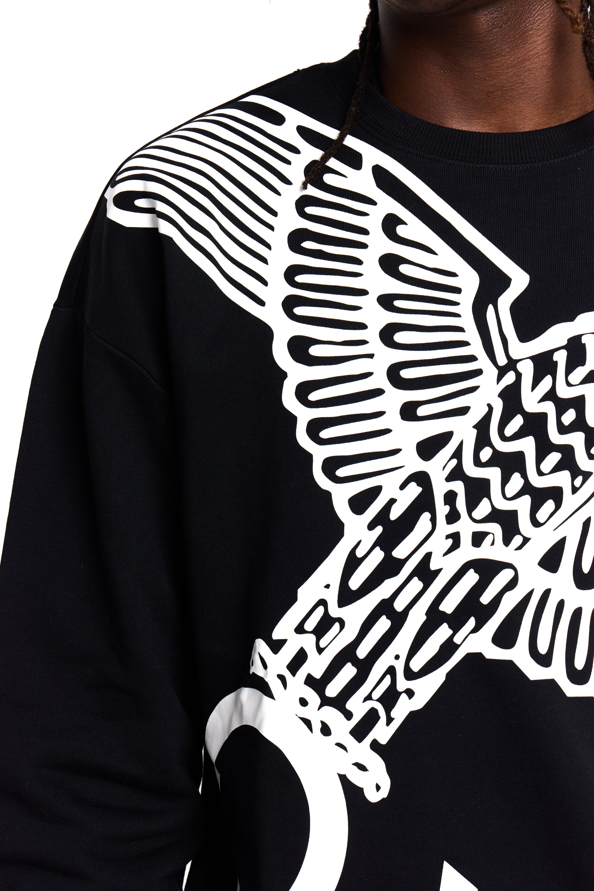Model wearing BOY London sweatshirt with a large white eagle design on a white background