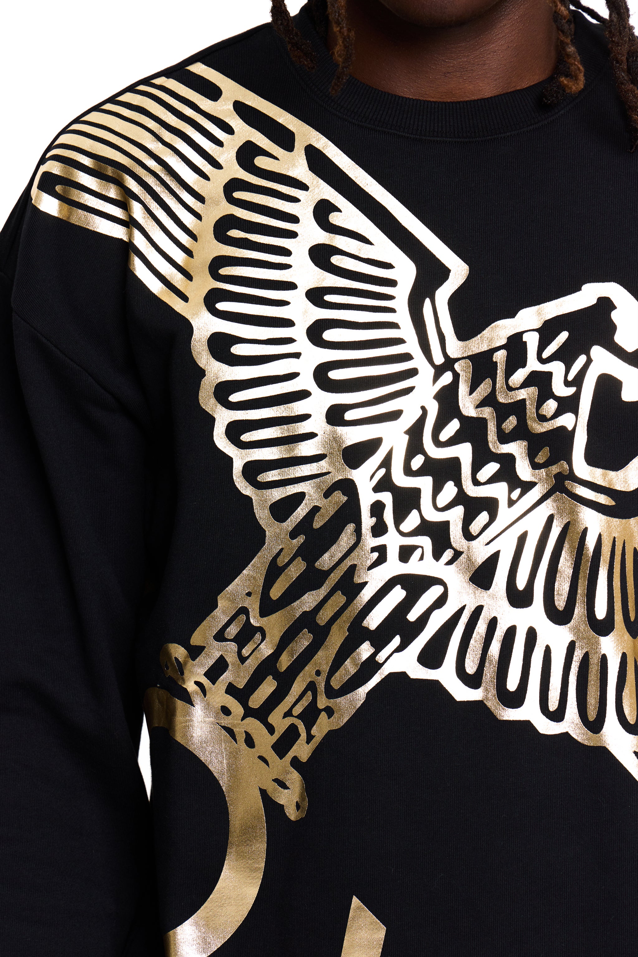 Black BOY London sweatshirt with gold eagle design worn by a person