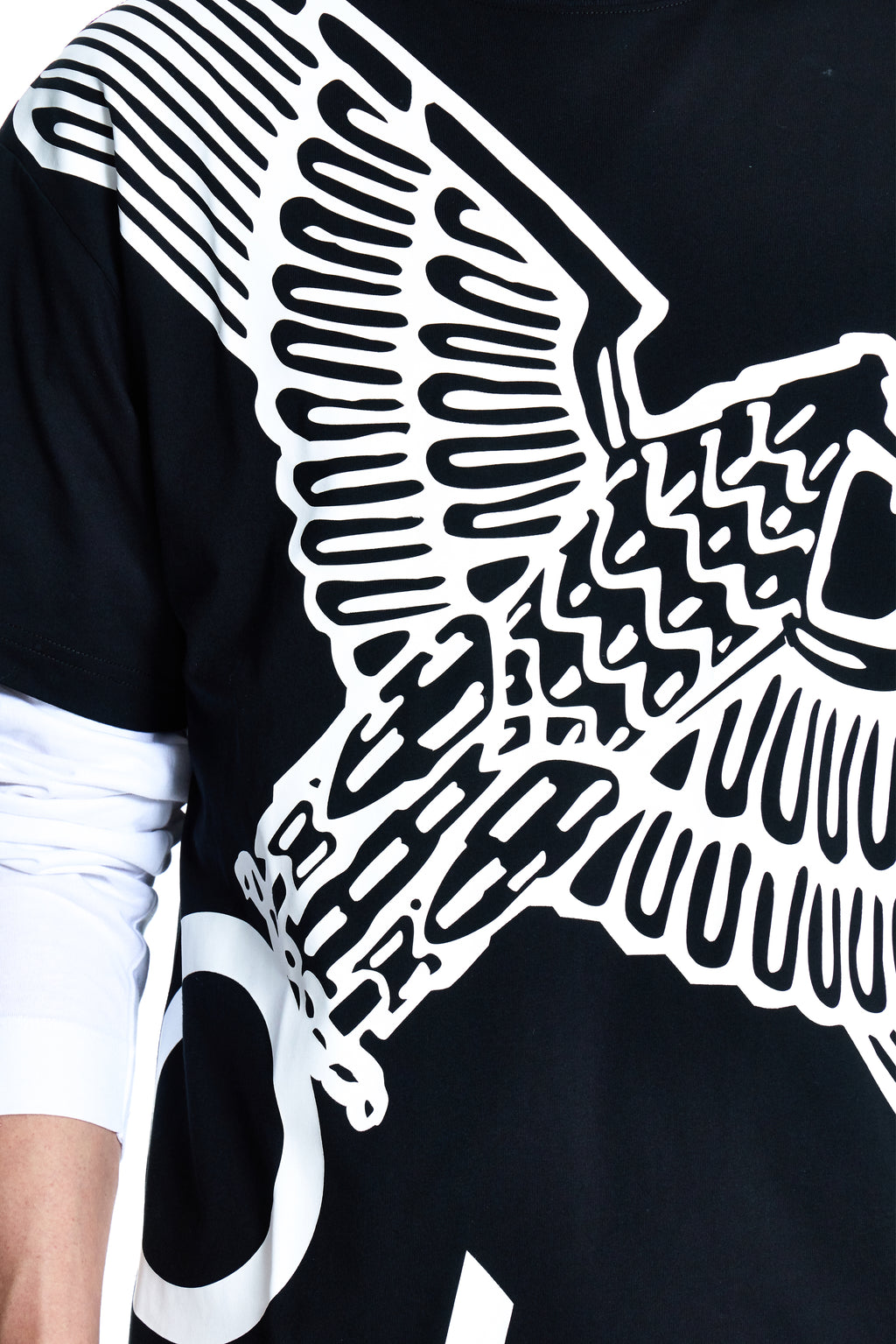 Black t-shirt with white winged design on a plain background