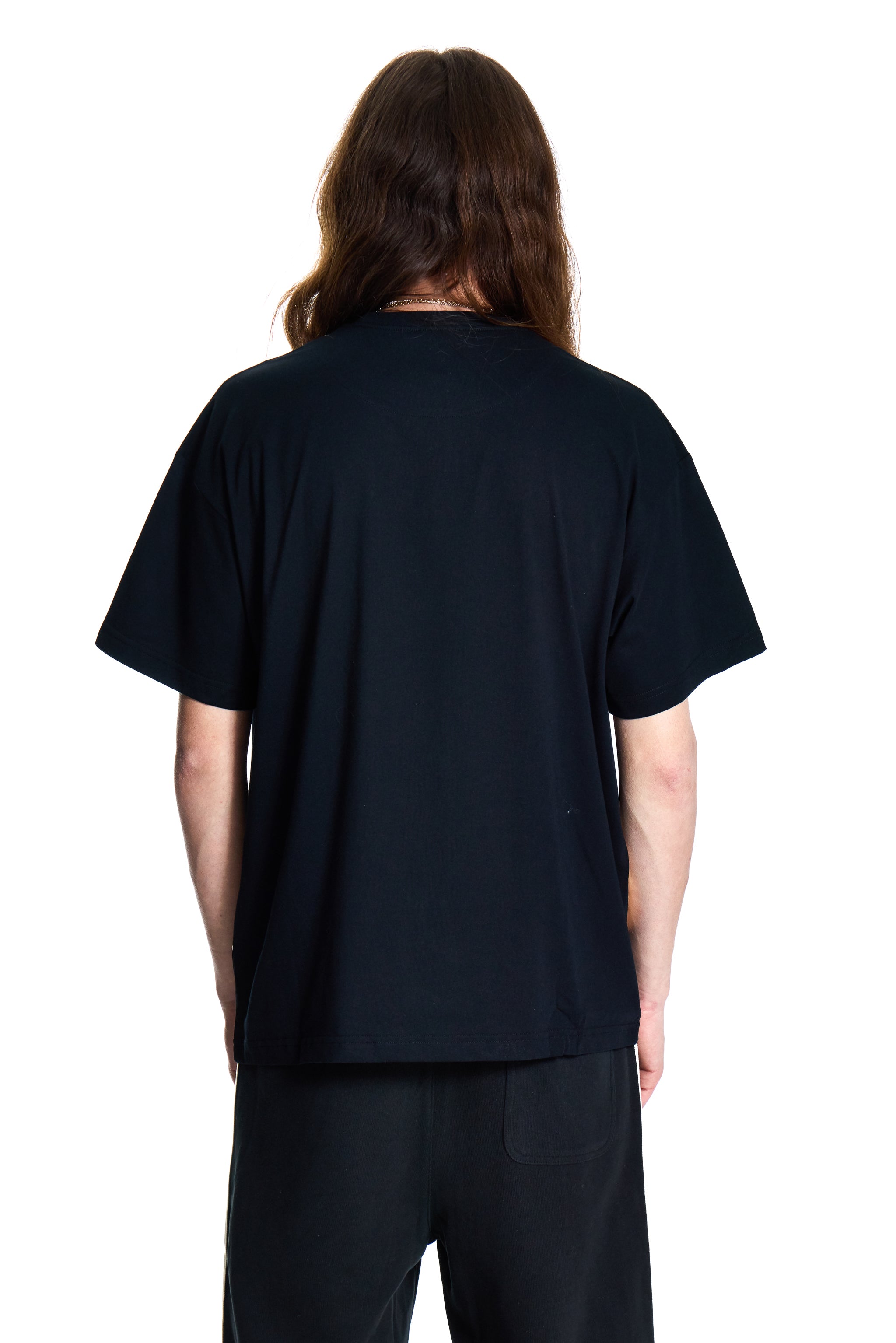 Person wearing a black t-shirt on a white background