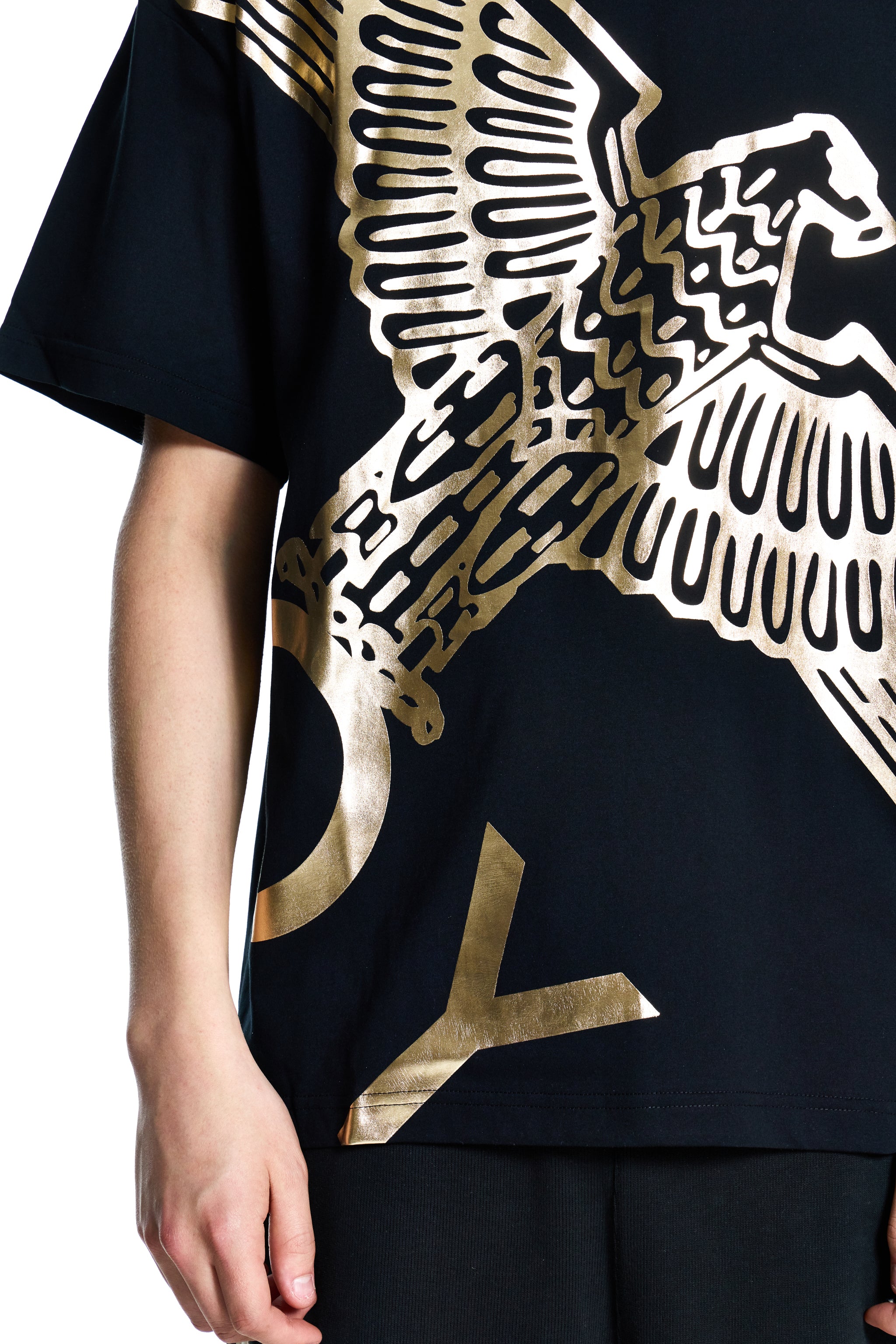 Black t-shirt with gold eagle design on a white background