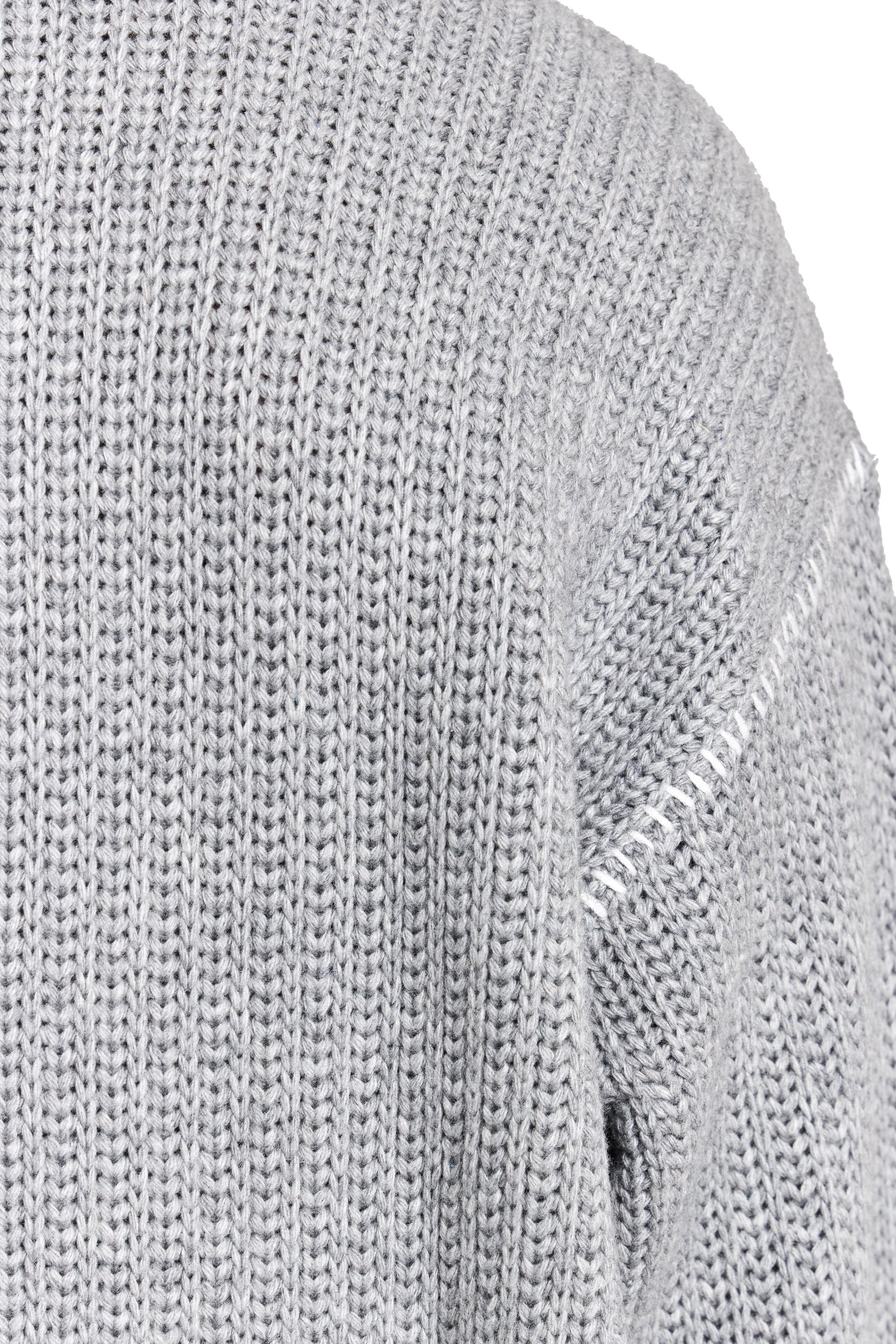 Close-up of a gray knit sweater with brand logo.