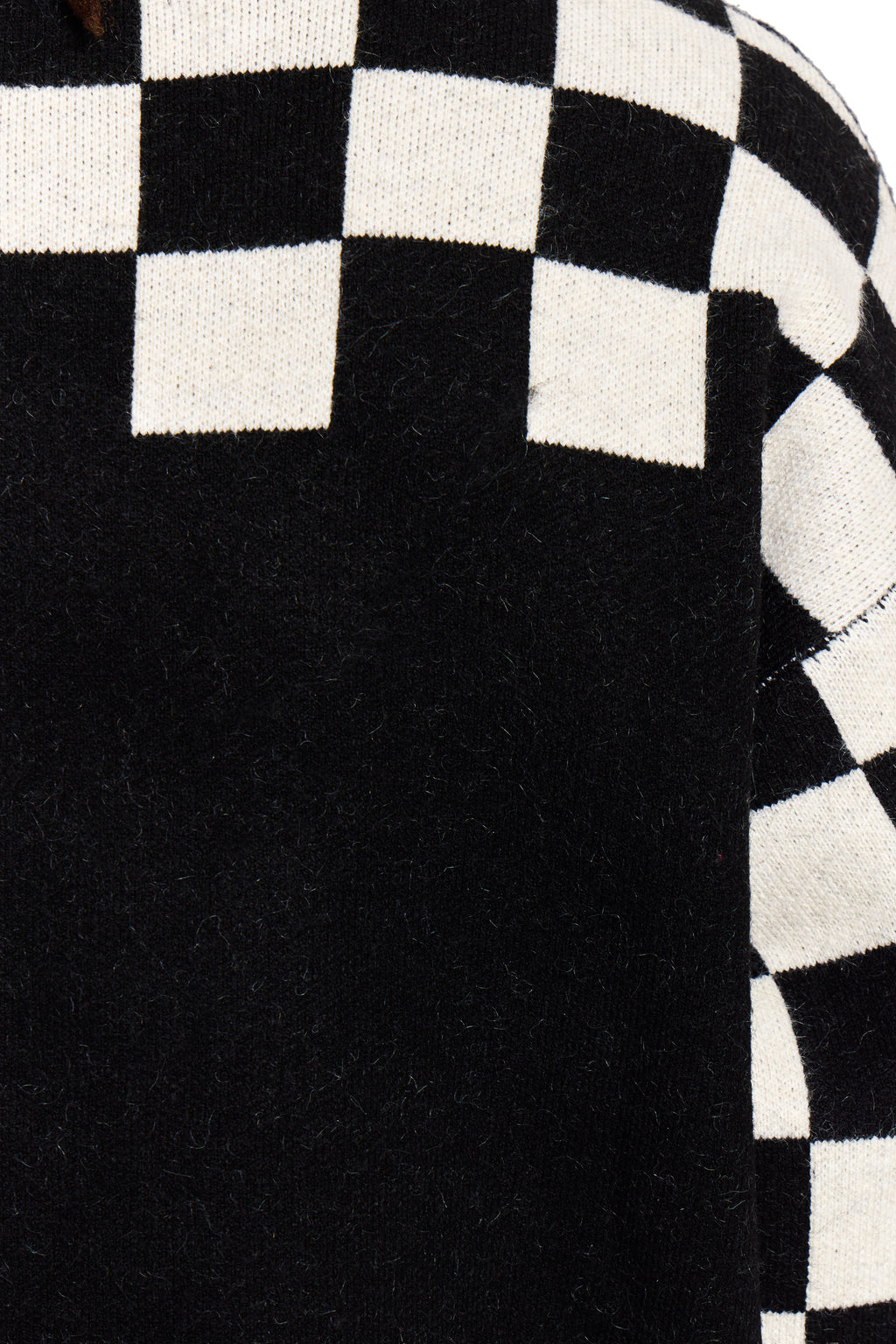 Close-up of a black and white checkered pattern on fabric
