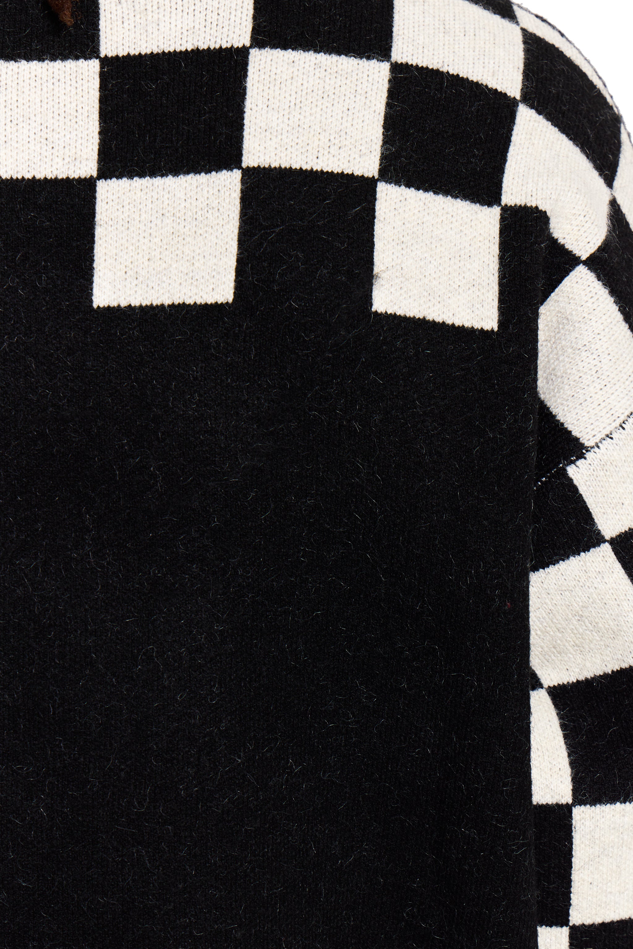 Close-up of a black and white checkered pattern on fabric