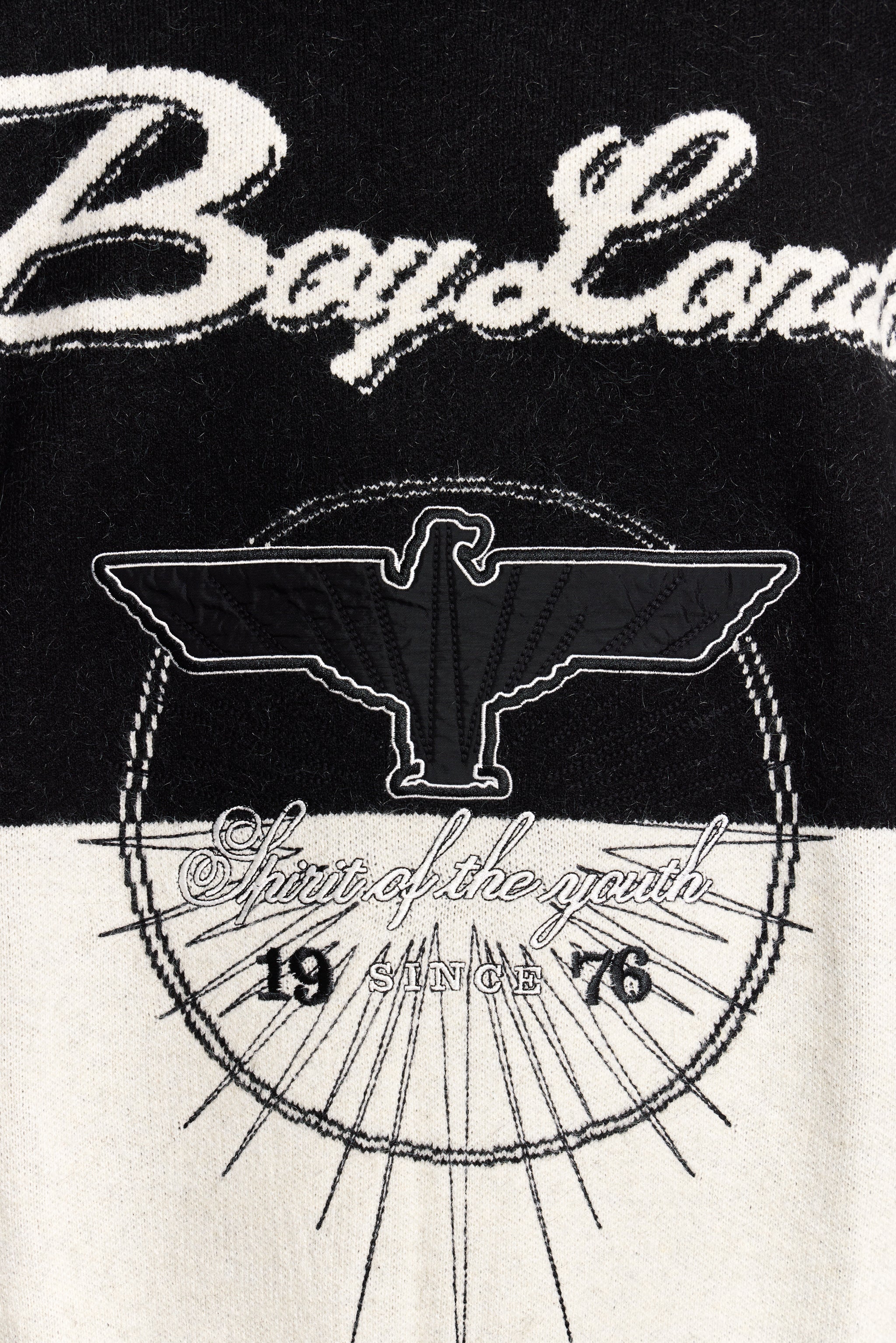 Black and white logo with text on a black and white background