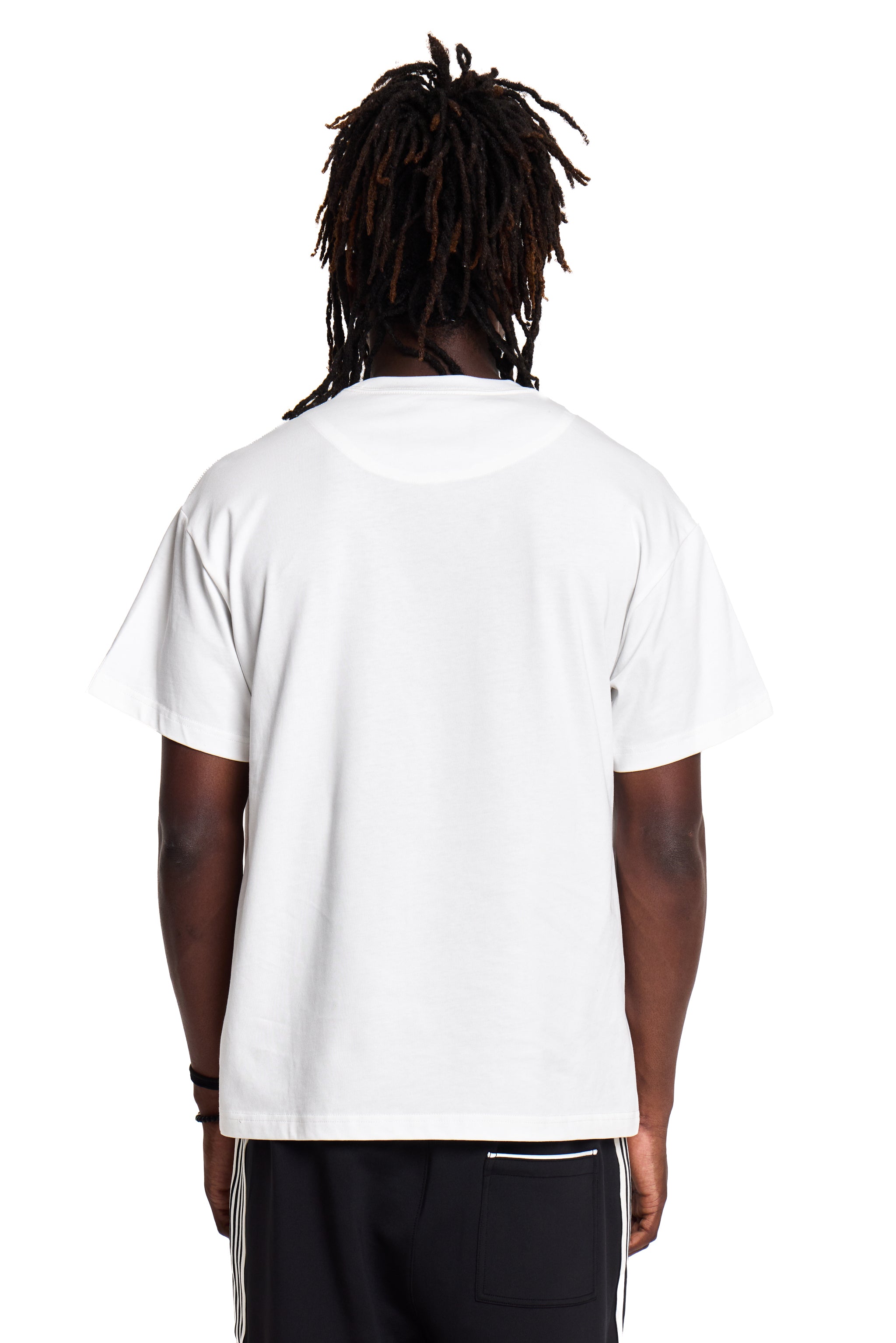 Person wearing a white t-shirt on a white background
