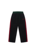 BOY London pants with red side stripe on a white background