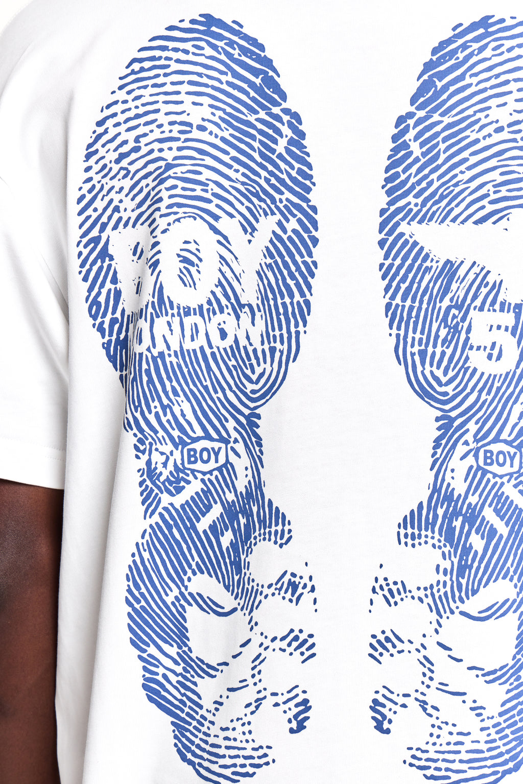 White t-shirt with blue fingerprint design and 'BOY' text on a white background