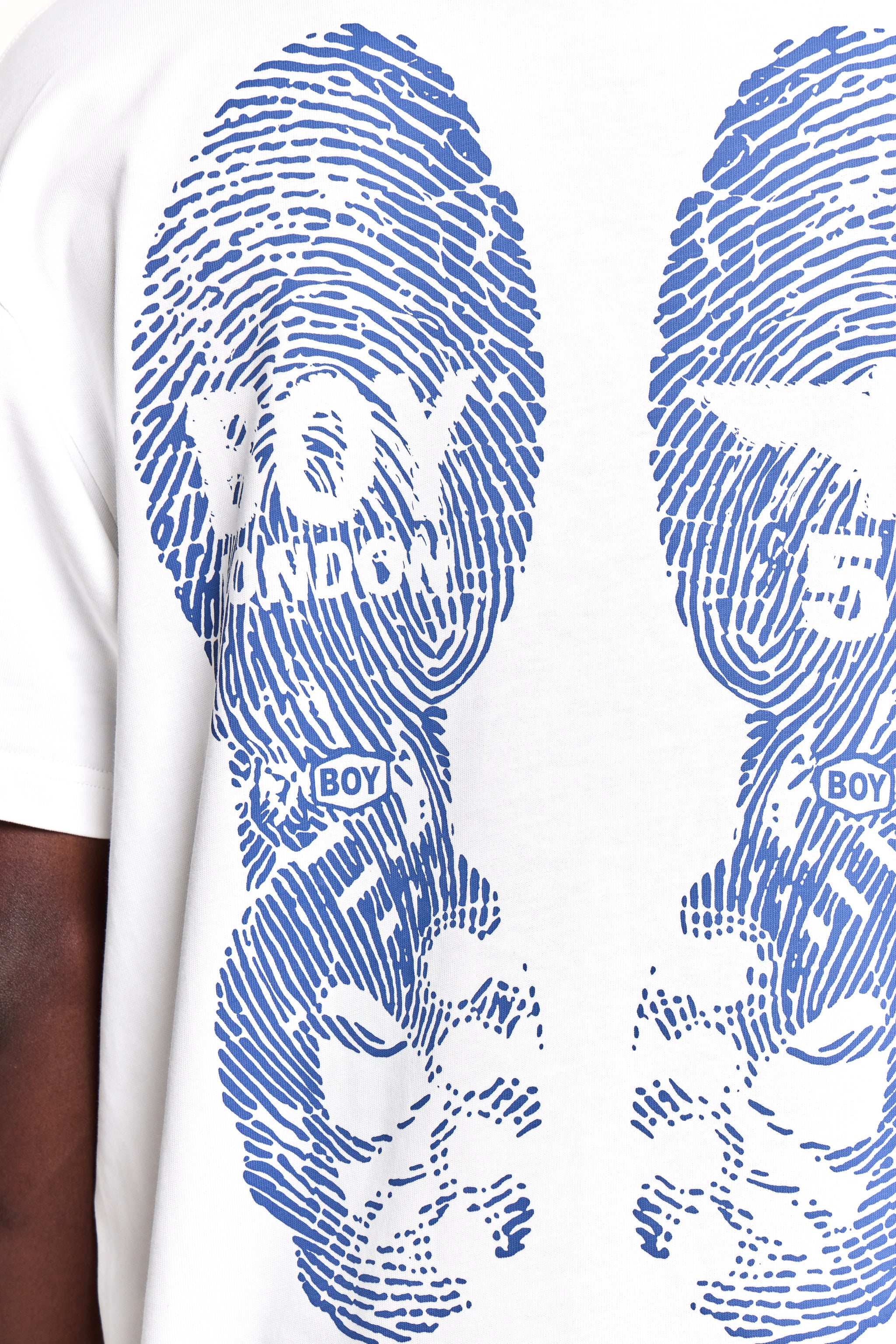 White t-shirt with blue fingerprint design and 'BOY' text on a white background