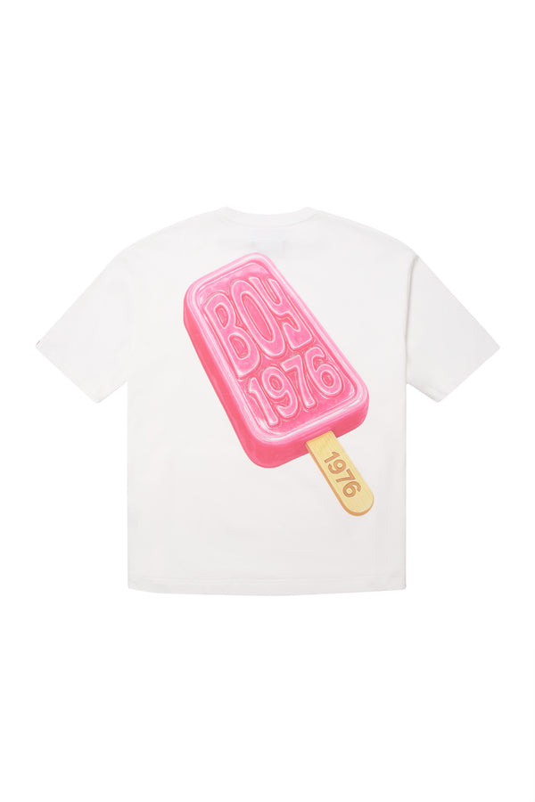 White t-shirt with a pink popsicle graphic and 'BOY 1976' text on a white background