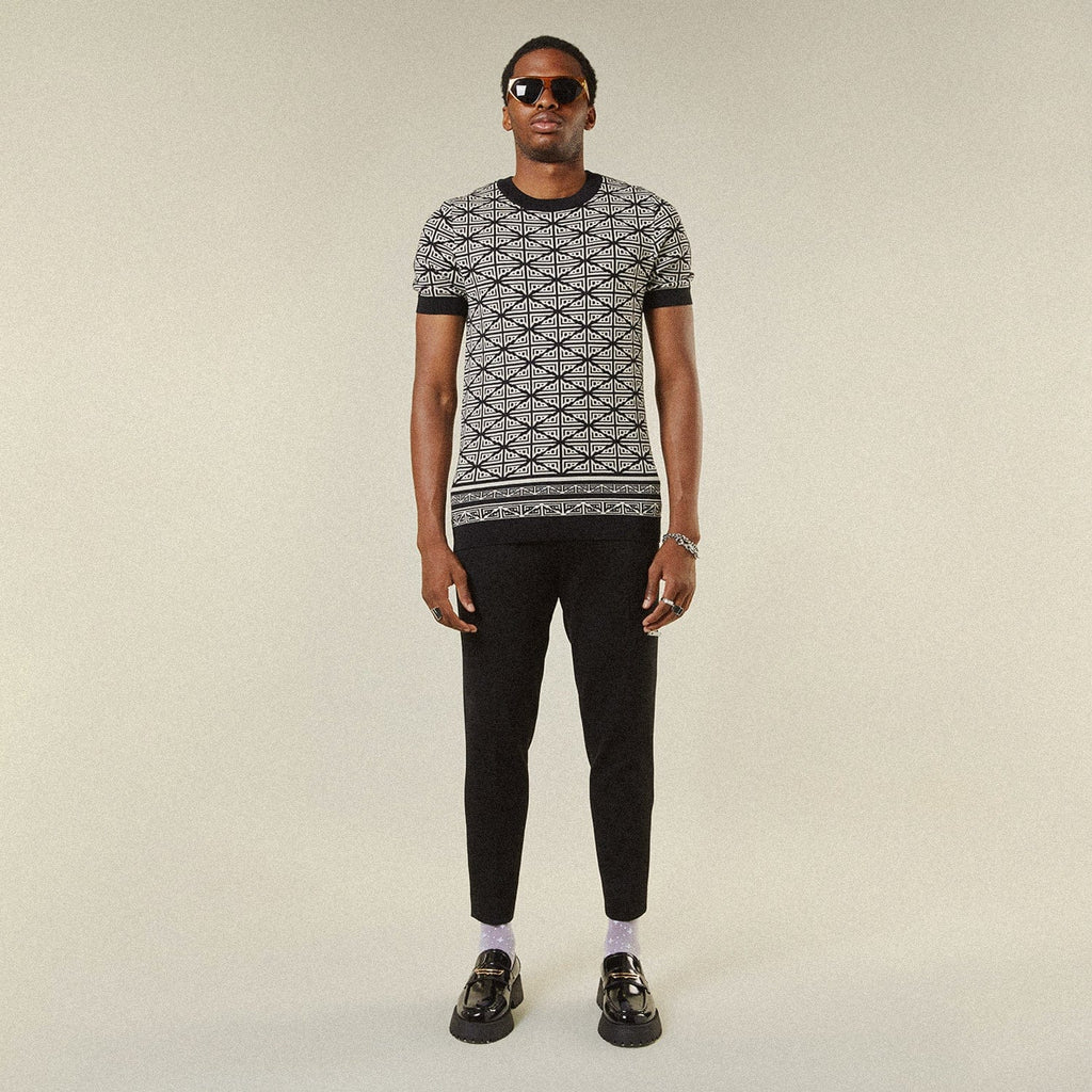 Model wearing BOY London trousers on white background