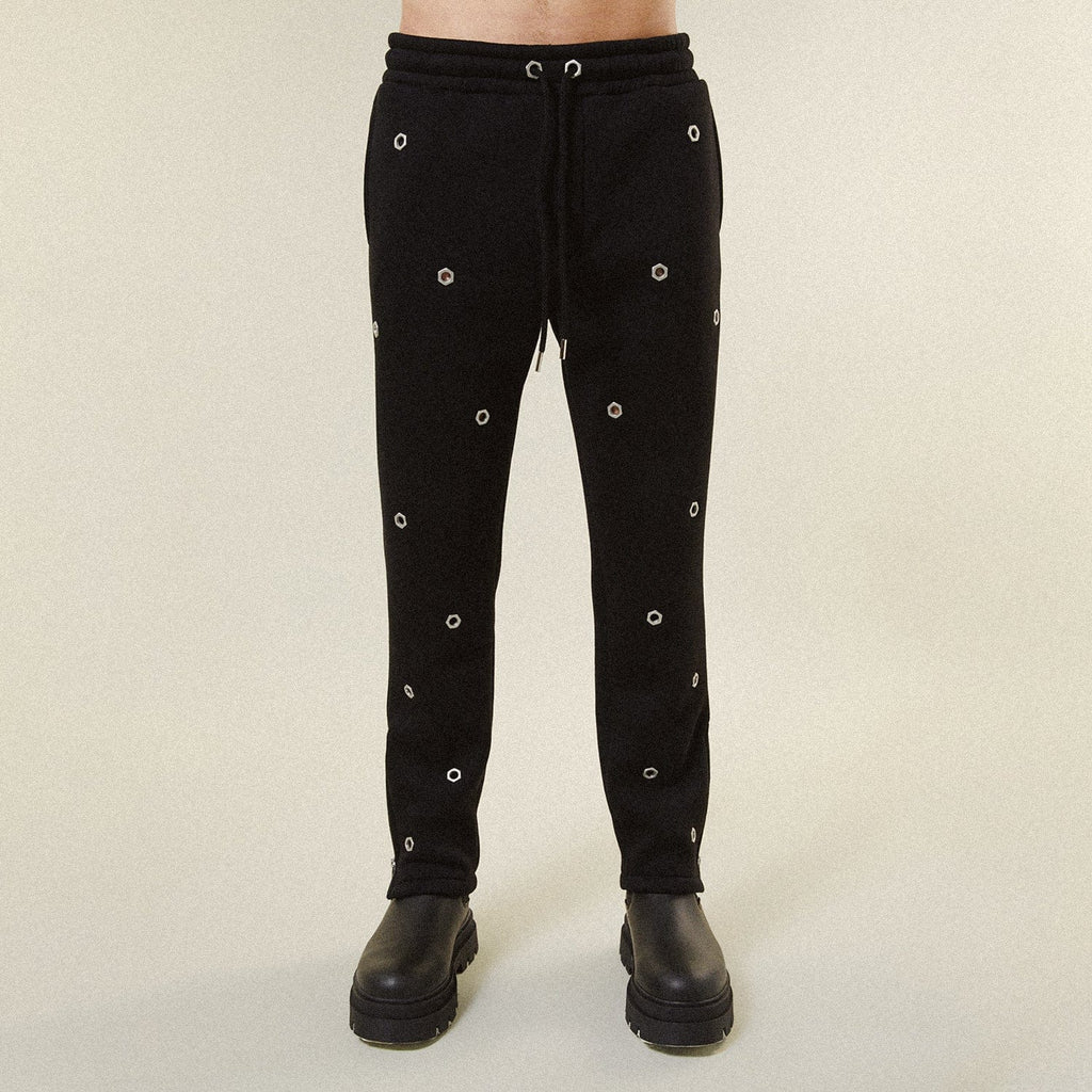 Model wearing BOY London trousers on white background