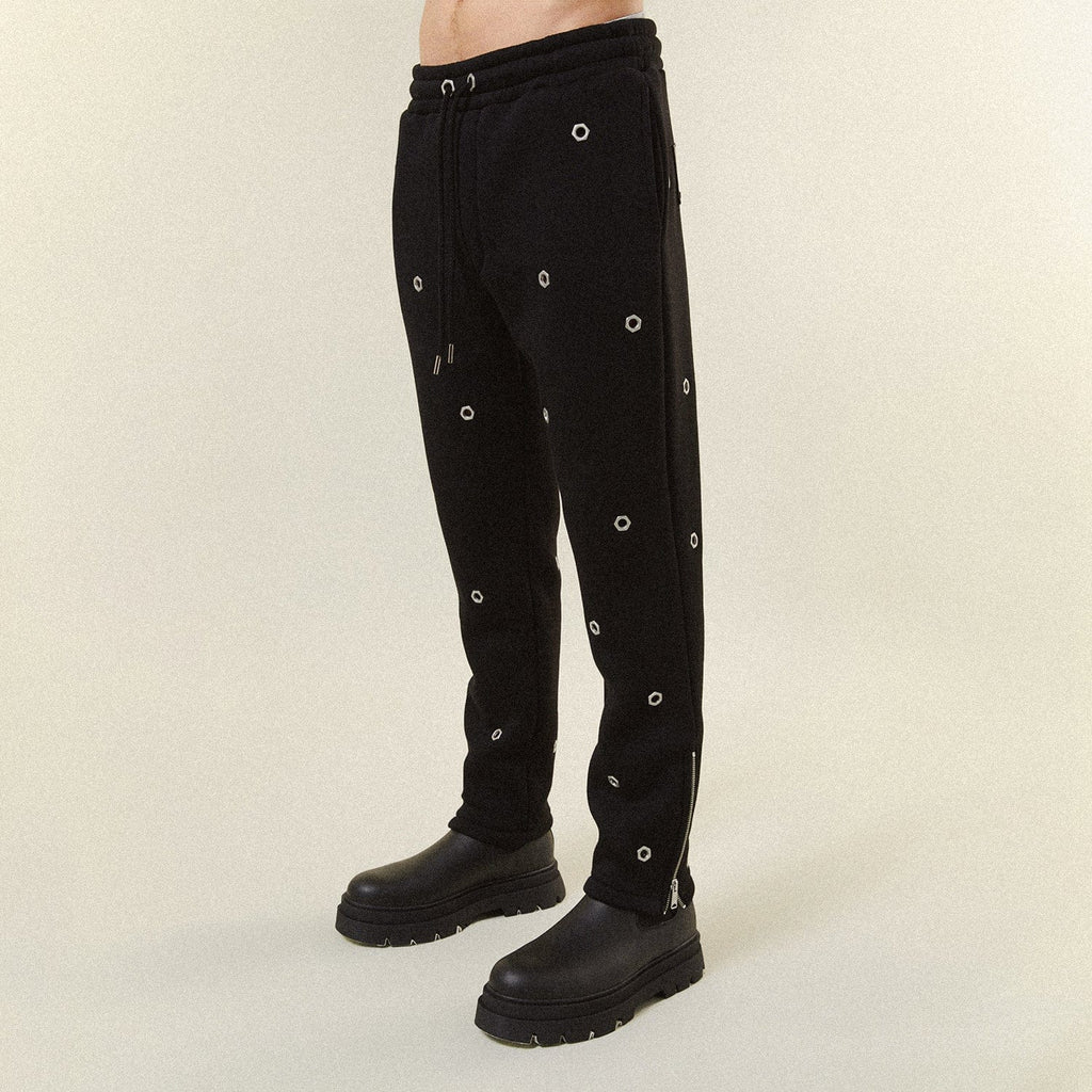 Model wearing BOY London trousers on white background