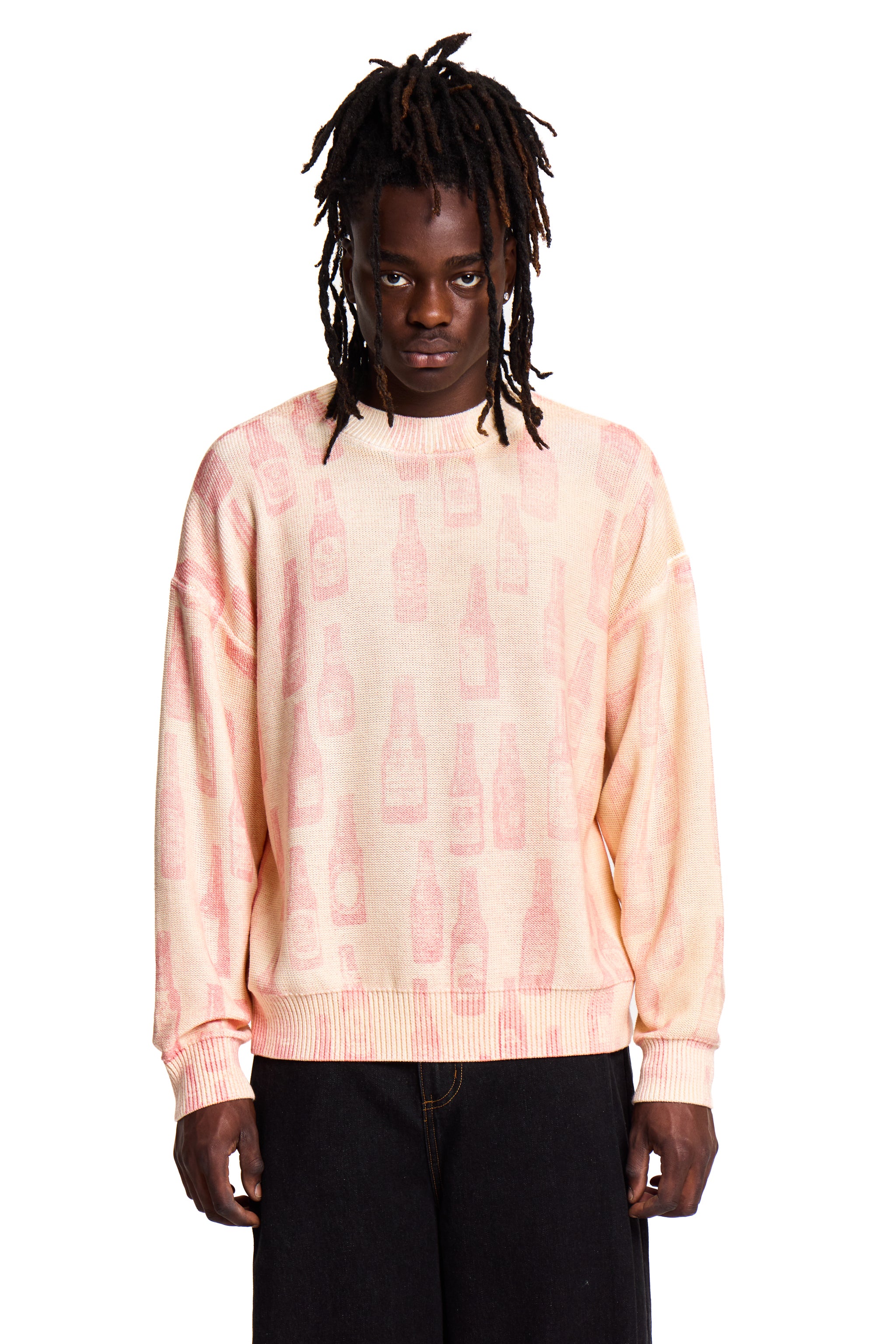 Person wearing a tie-dye Boy London sweater on a white background