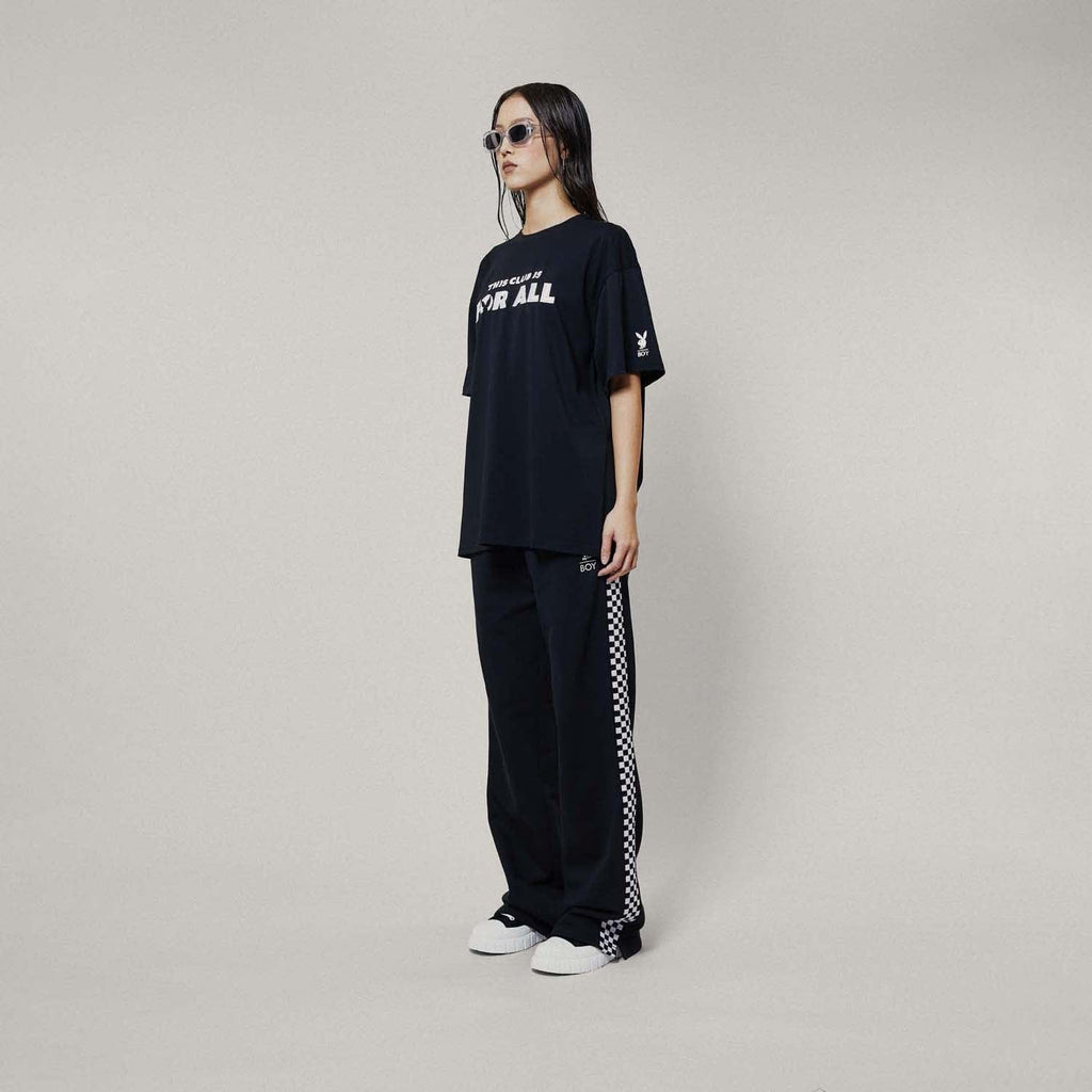 Model wearing boy london joggers on white background