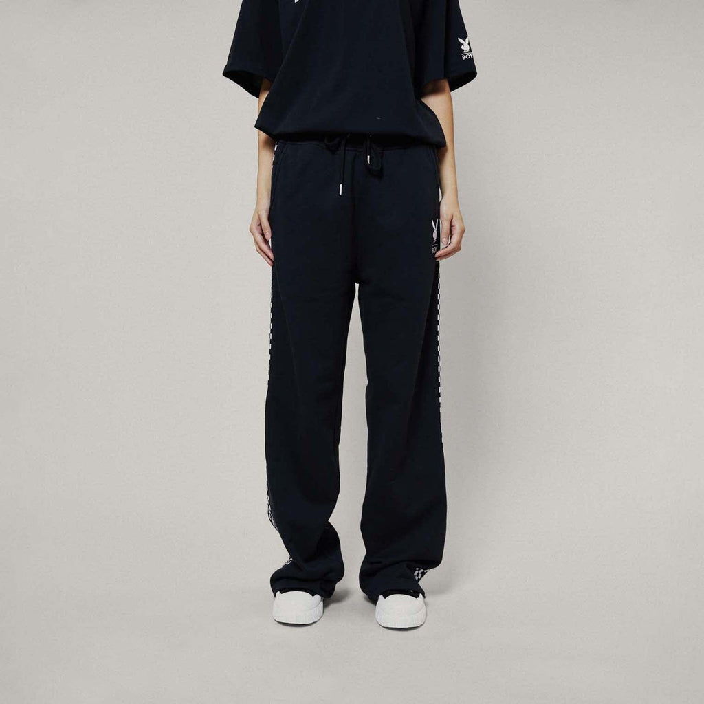 Model wearing boy london joggers on white background