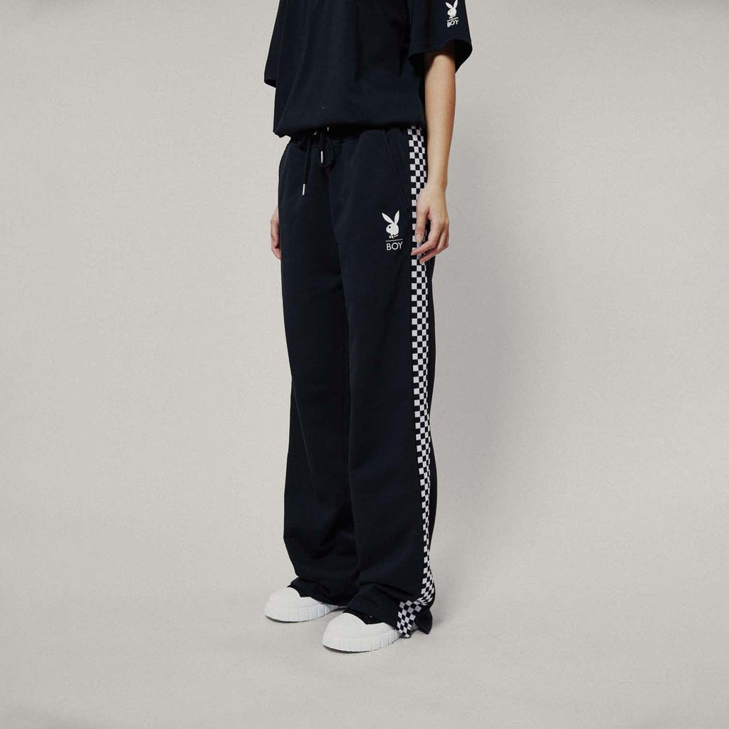 Model wearing boy london joggers on white background