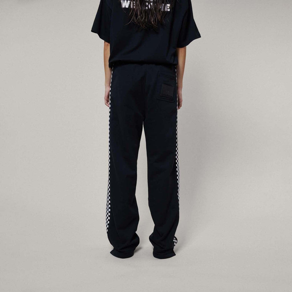 Model wearing boy london joggers on white background