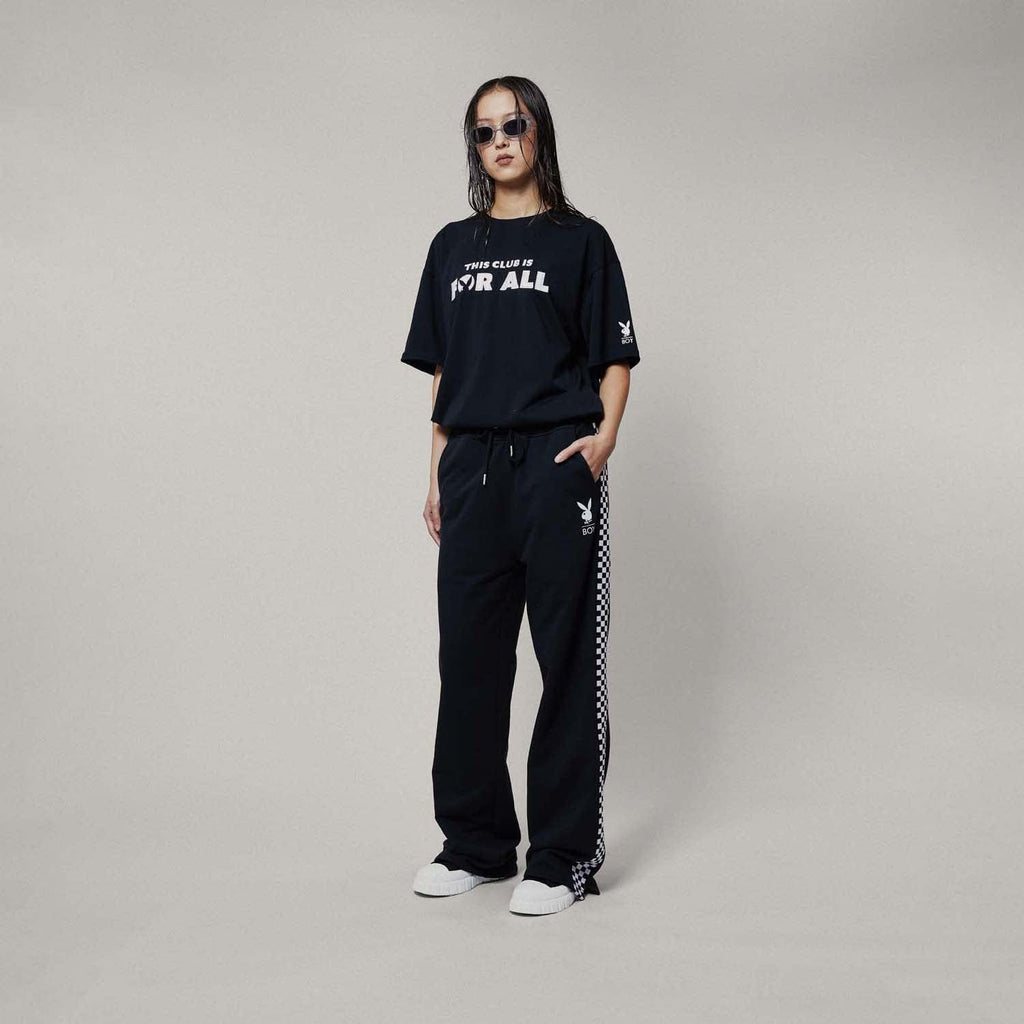 Model wearing boy london joggers on white background