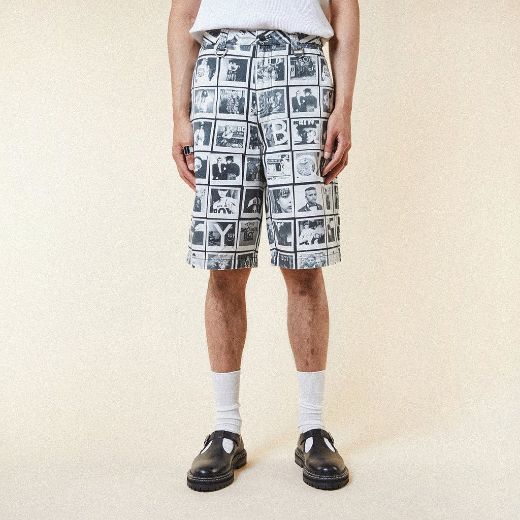 Model wearing BOY London Pants with a black and white photo collage pattern on a white background
