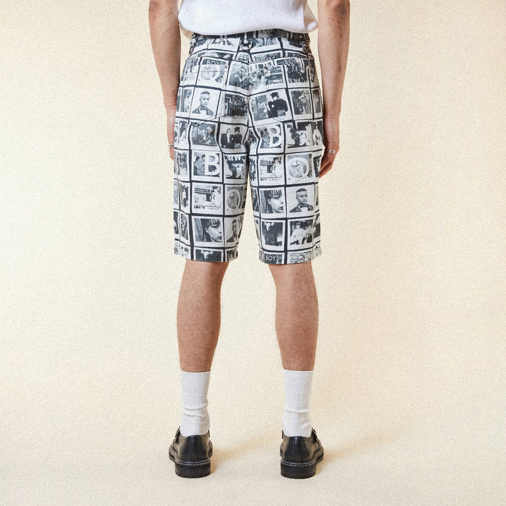 Model wearing BOY London Pants with a black and white photo collage pattern on a white background