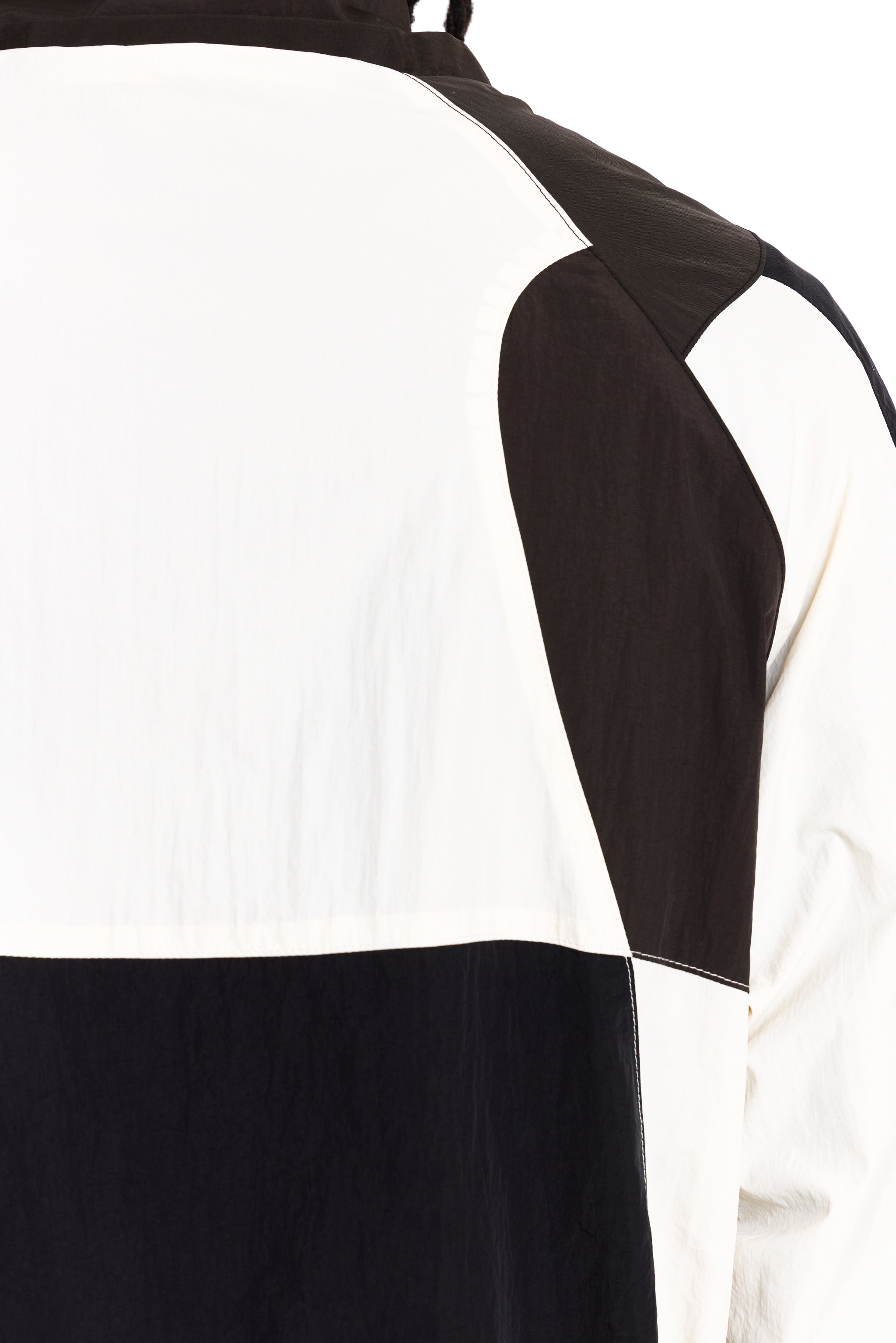 Black and white striped dress with cut-out shoulder design on a white background